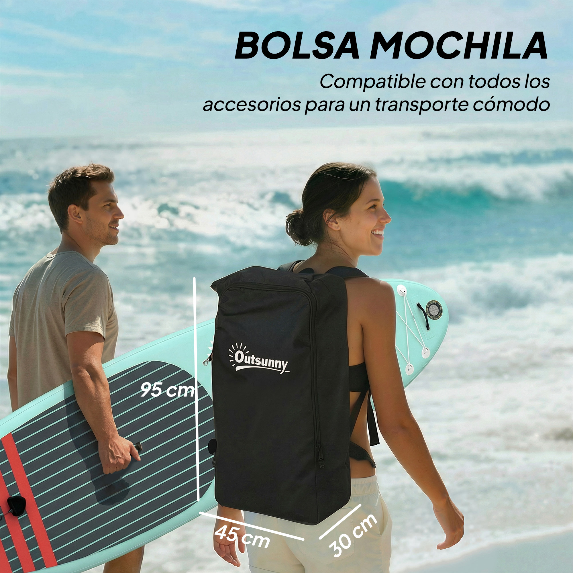 Un hombre y una mujer llevan una tabla de paddle surf en la playa.