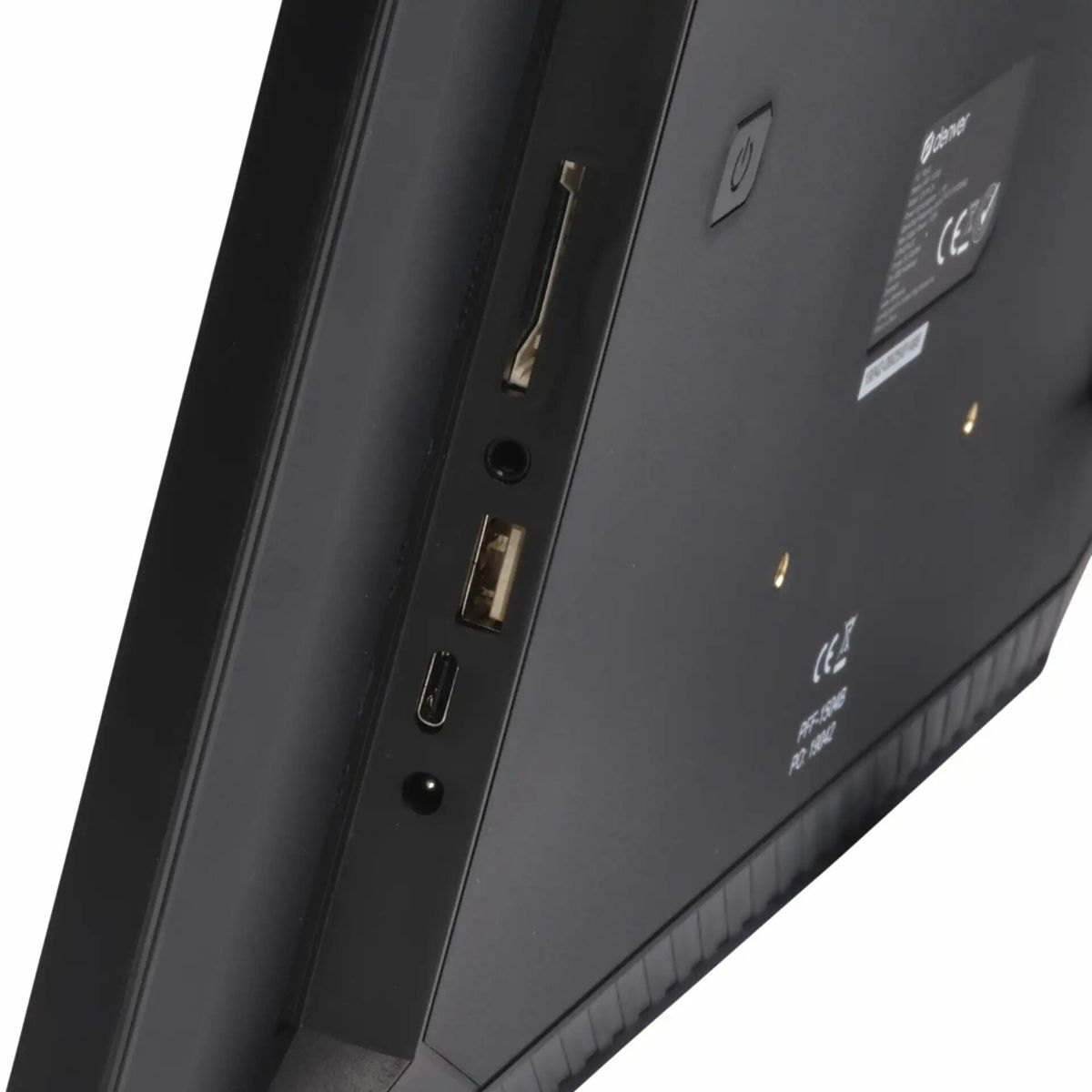 Arrière d'un appareil noir montrant les ports USB, carte SD et d'alimentation.