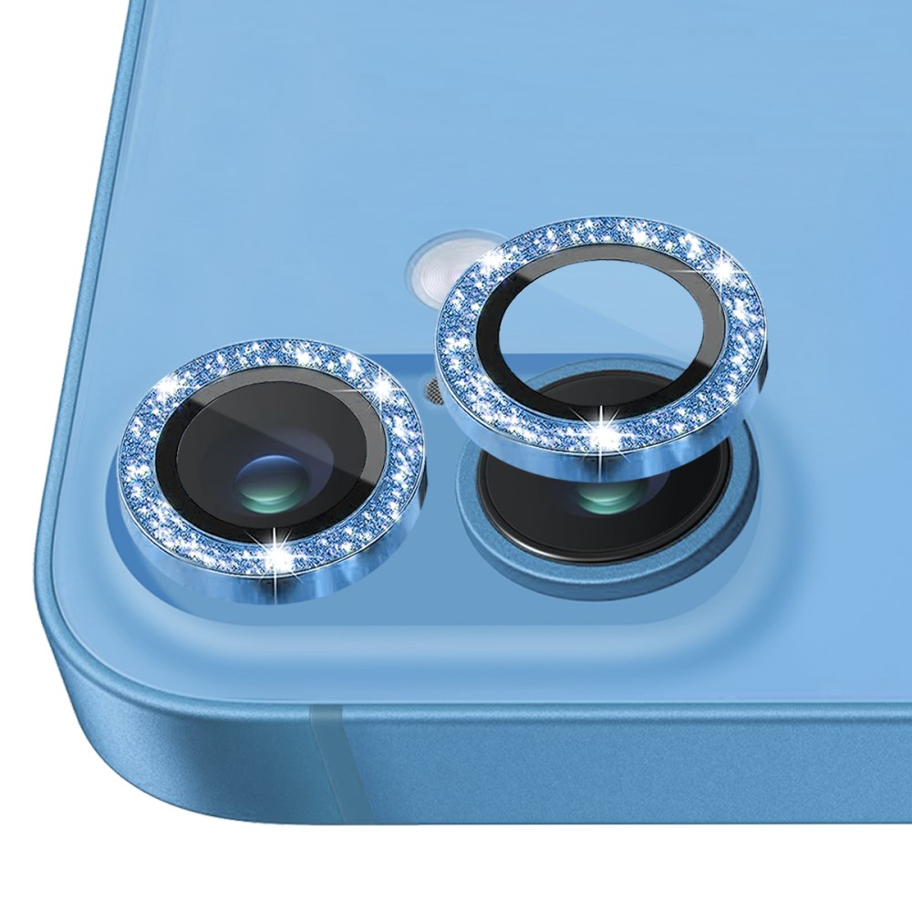 Telefono blu con due lenti della fotocamera, ognuna adornata con un anello di gemme blu scintillanti.