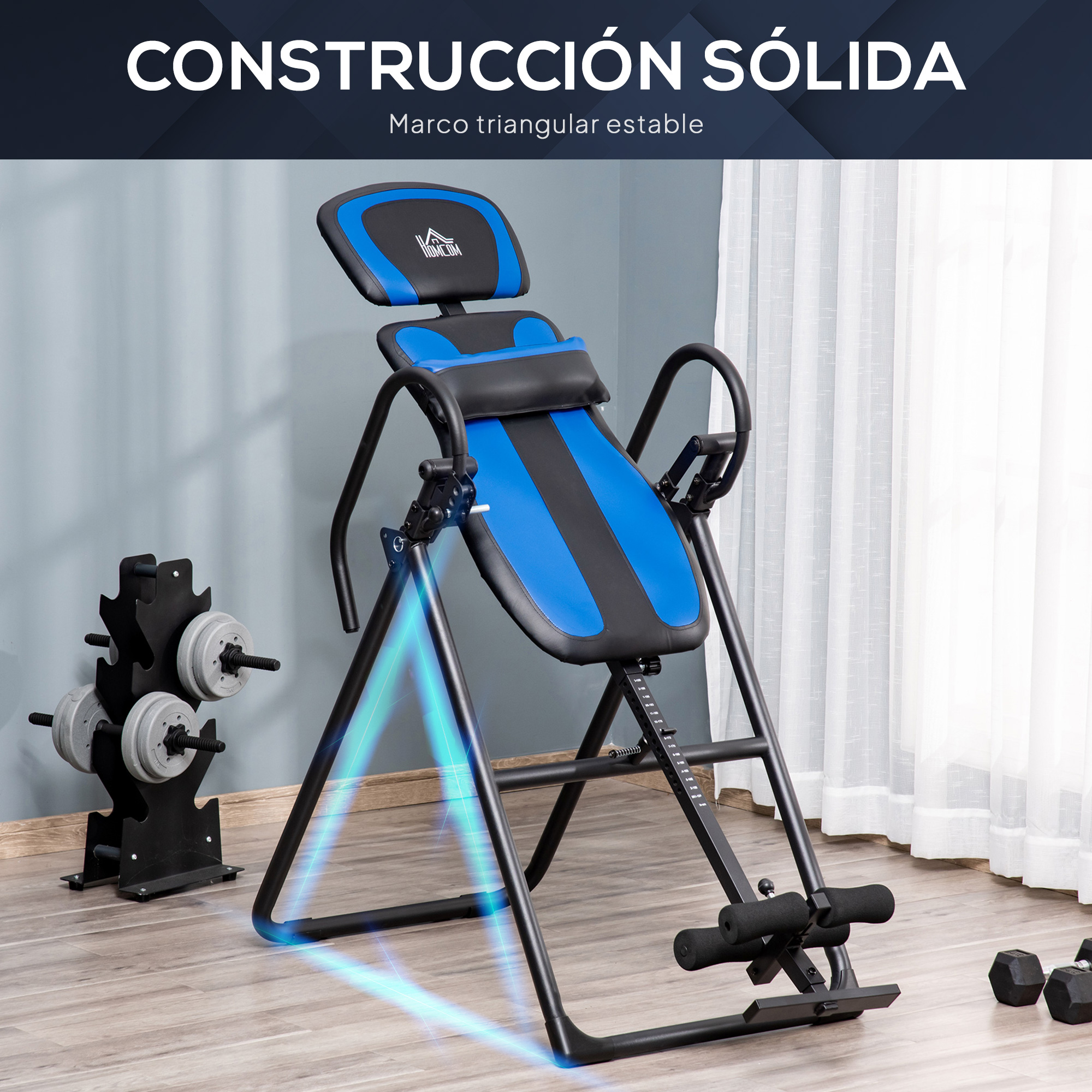 Una mesa de inversión azul y negra está en una habitación con mancuernas y pesas.
