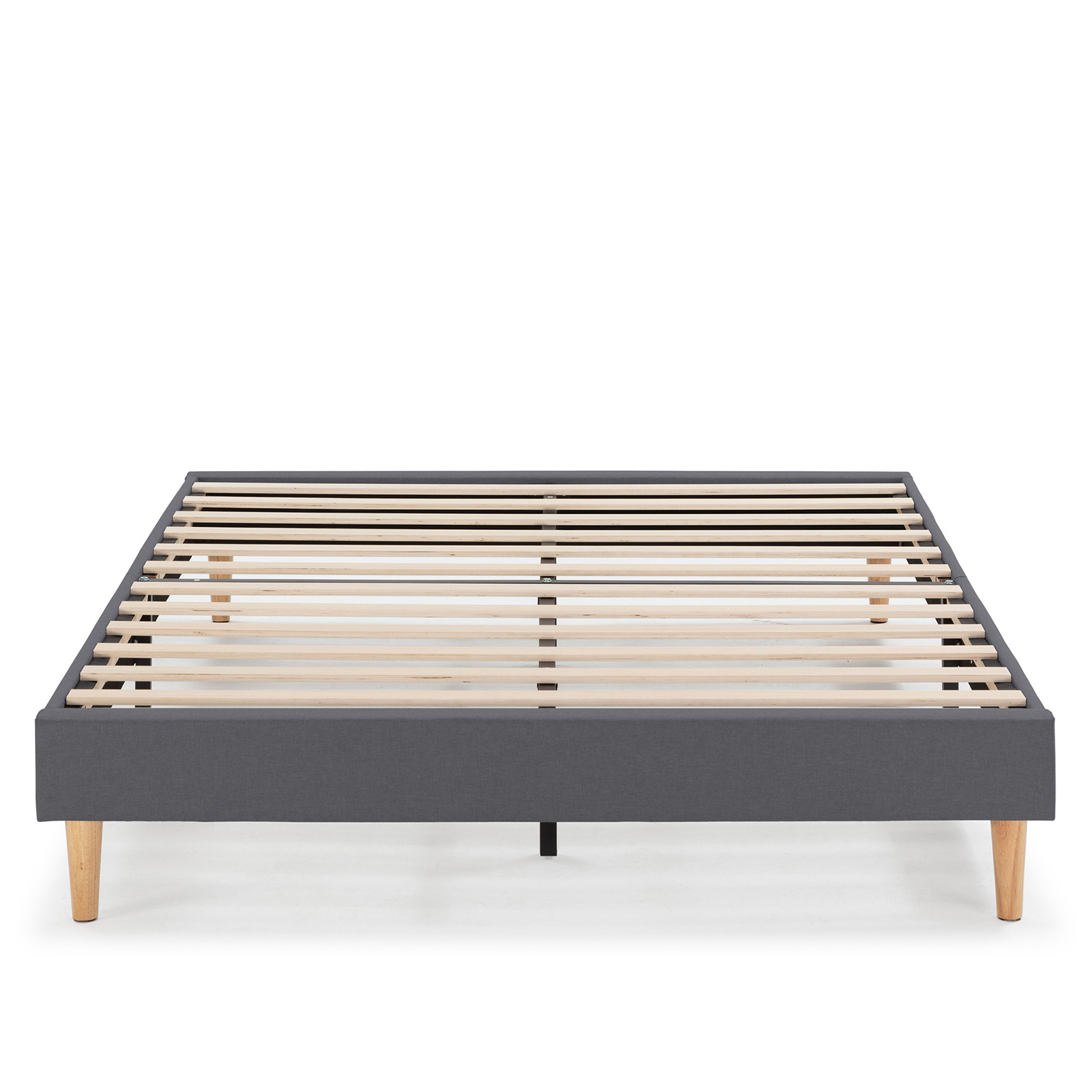 Un somier tapizado en gris con listones de madera y cuatro patas.