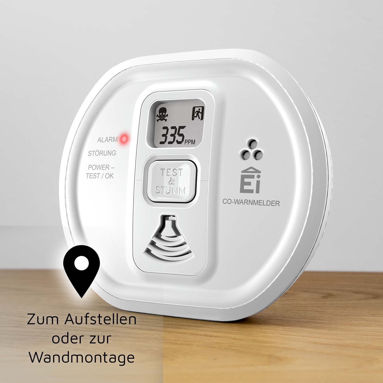 Ein weißer CO-Melder mit rotem Alarmlicht und digitaler Anzeige von 335 PPM.
