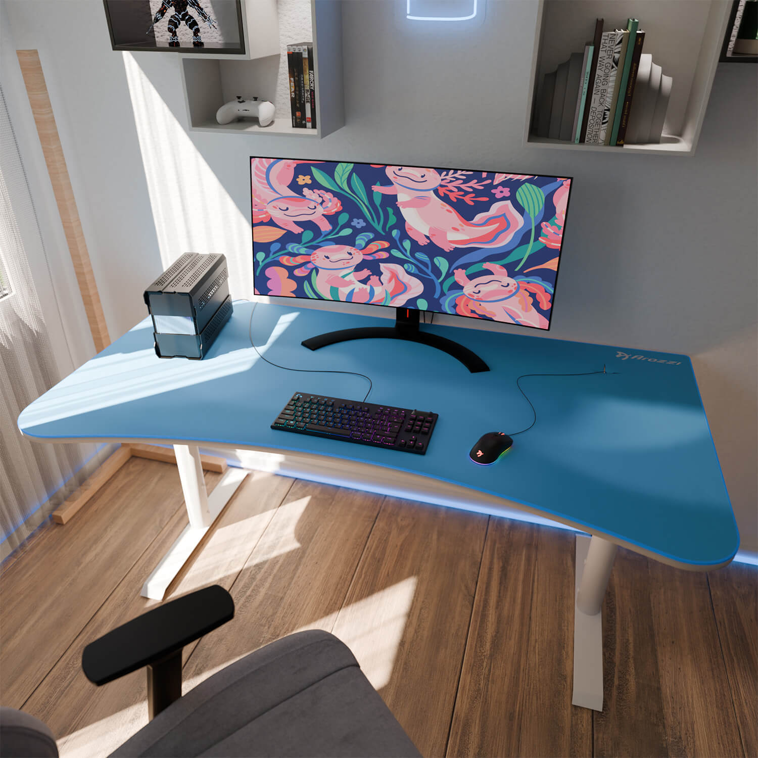 Una scrivania con tappetino blu, tastiera, mouse, PC e monitor con sfondo di axolotl.