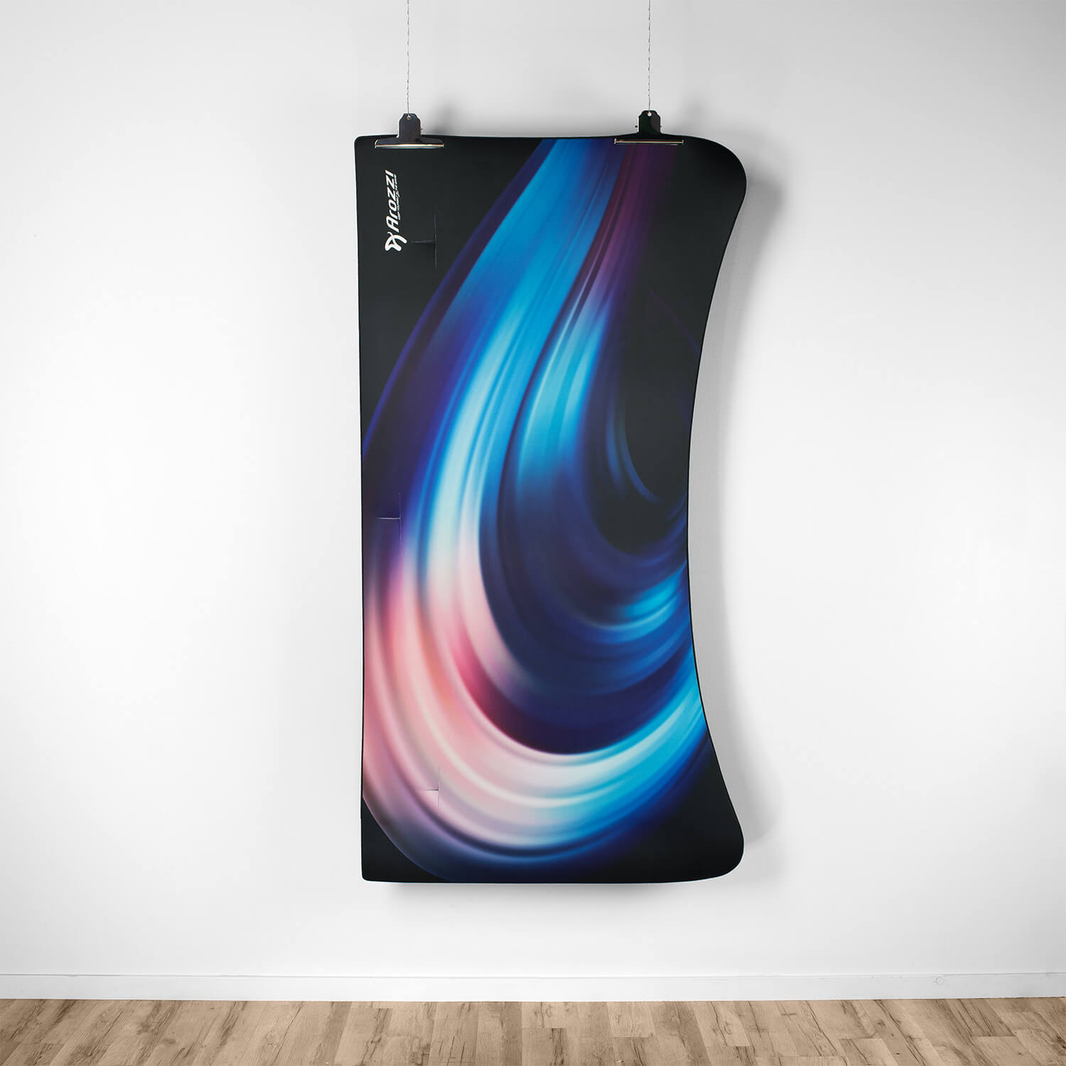 A black banner with blue and purple swirls, hanging on a white wall.