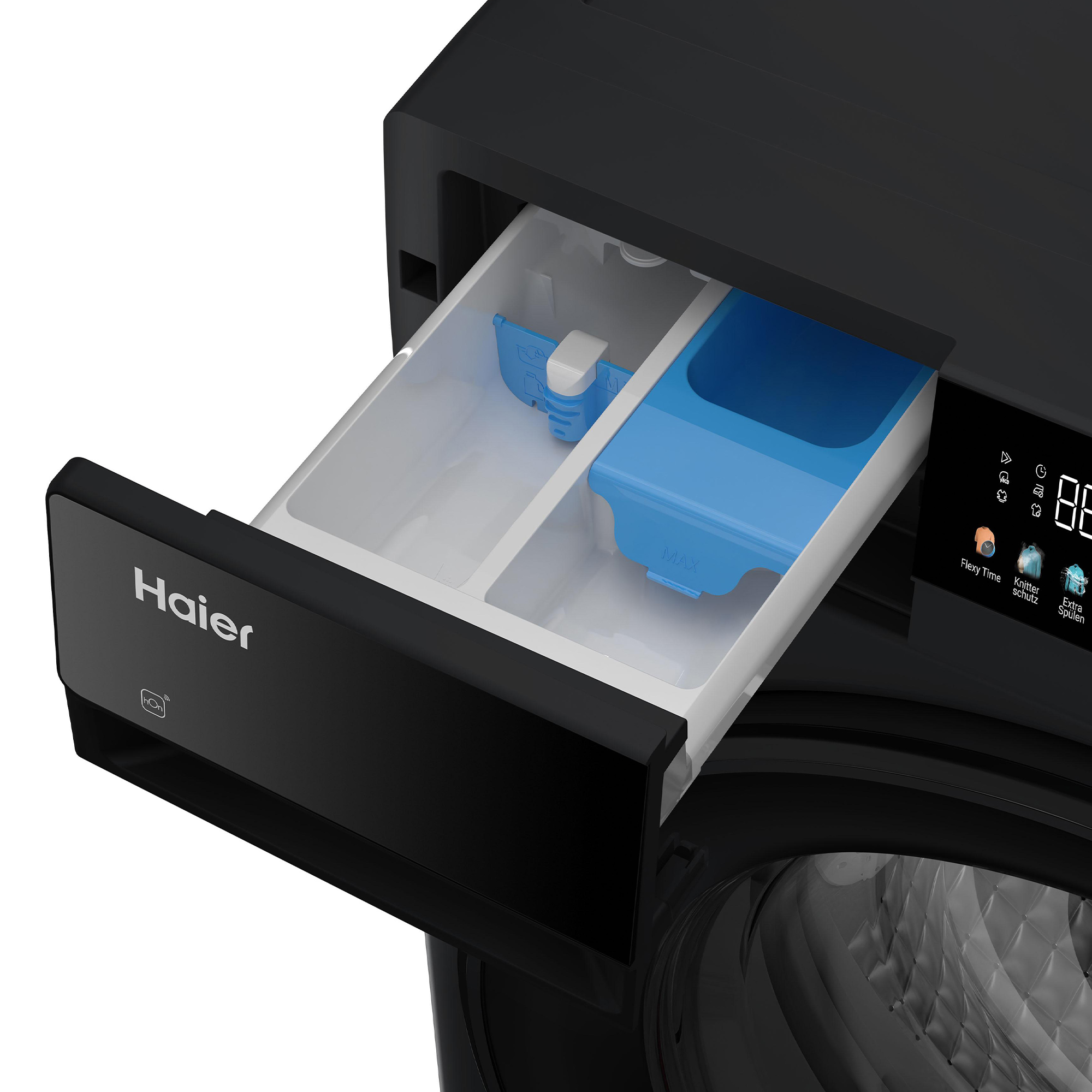 Schwarzer Waschmittelschubladen-Bereich einer Haier-Waschmaschine mit blauer Einlage.