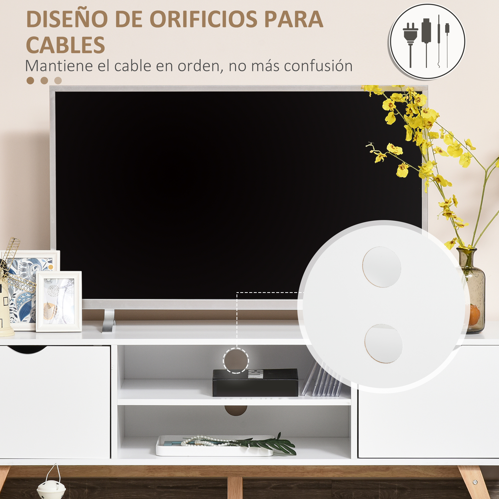 Un televisor en un mueble blanco con decoraciones y flores.