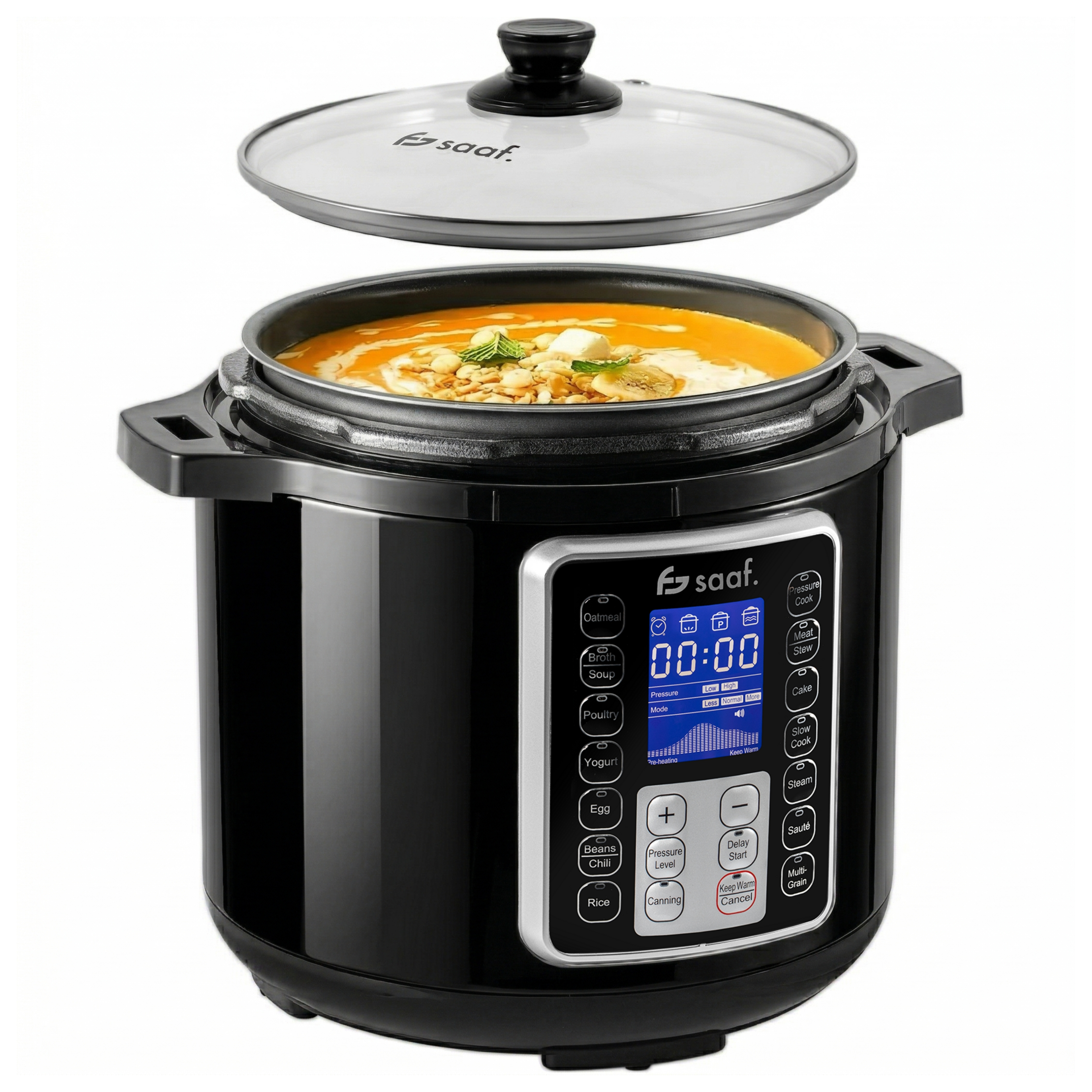 A black pressure cooker with a glass lid, containing orange soup.
