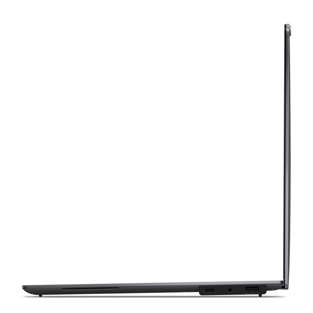 Widok z boku zamkniętego, smukłego laptopa z portami z boku.