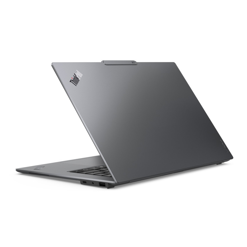 Szary laptop z otwartym ekranem, widoczna klawiatura i porty.