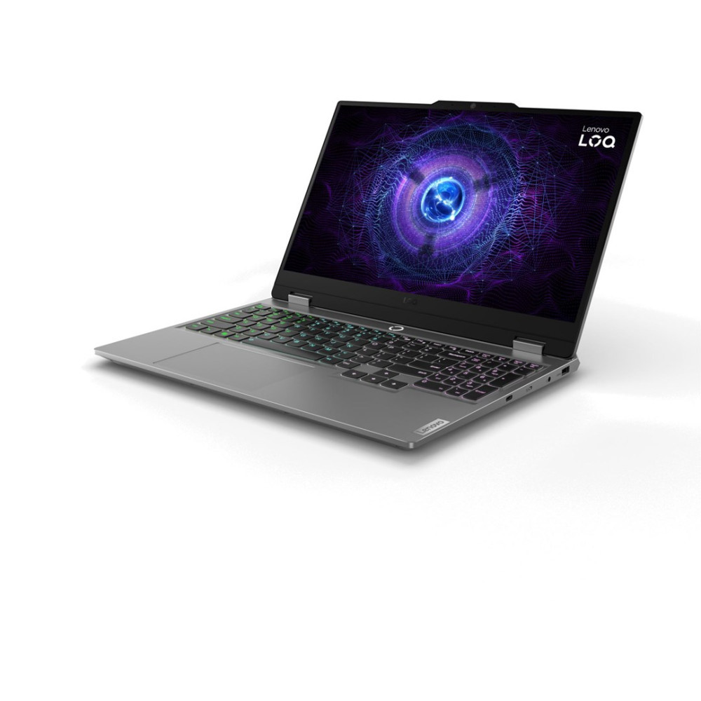 Szary laptop z podświetlaną klawiaturą i kosmiczną tapetą.
