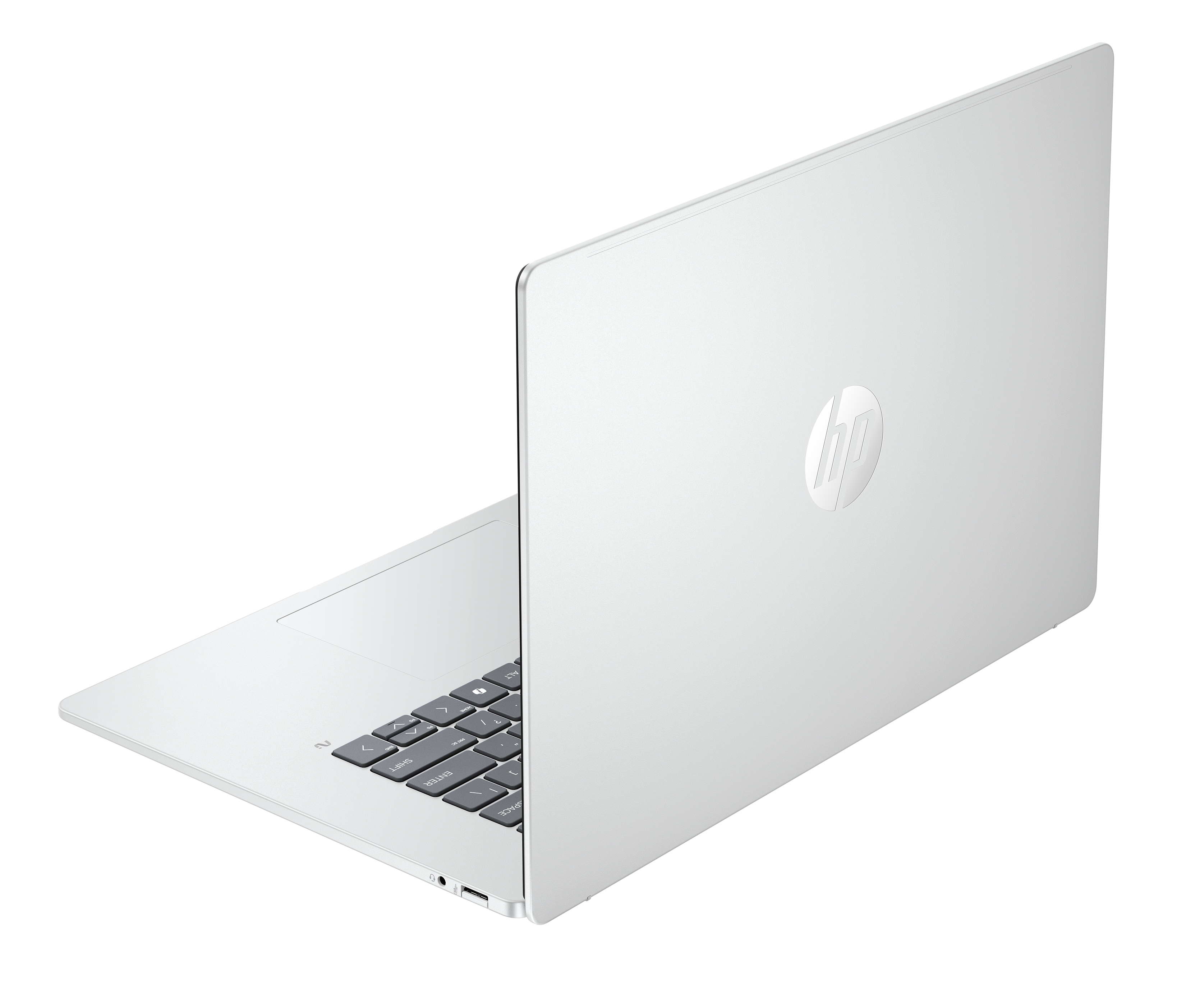 Un ordinateur portable HP argenté, partiellement ouvert, avec le logo sur le capot.