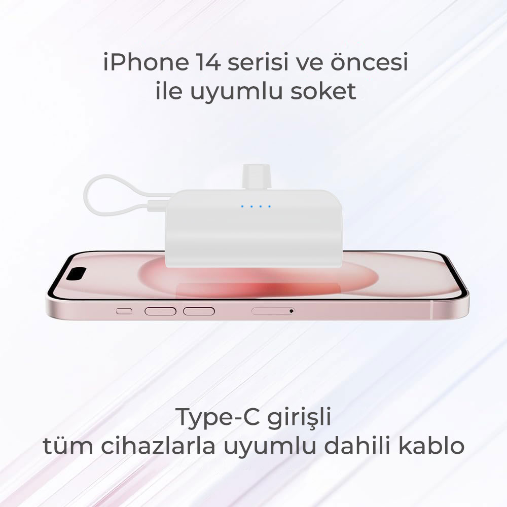 Kablolu beyaz şarj aksesuarı pembe bir iPhone üzerinde duruyor.