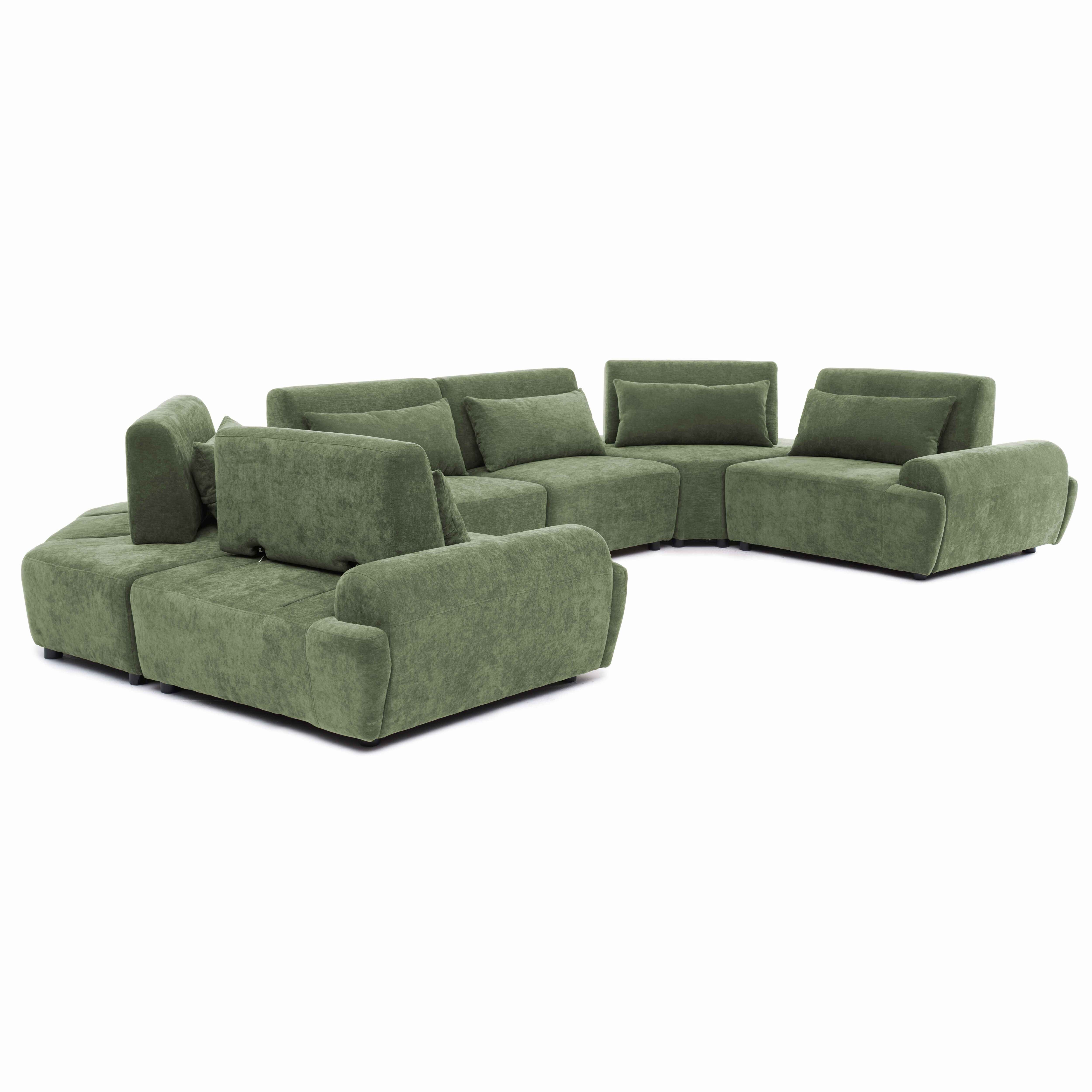 Ein modulares, grünes Sofa mit mehreren Sitzelementen und Kissen.