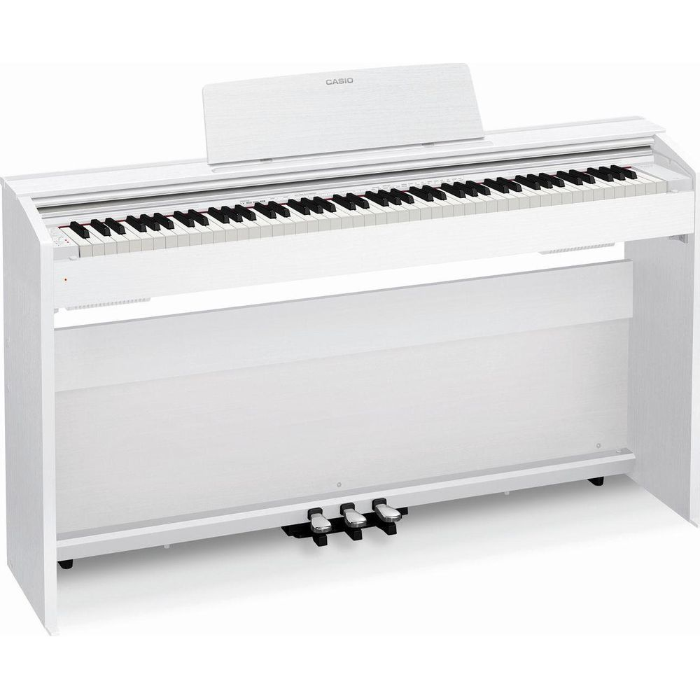 Un piano numérique blanc avec des touches et trois pédales.