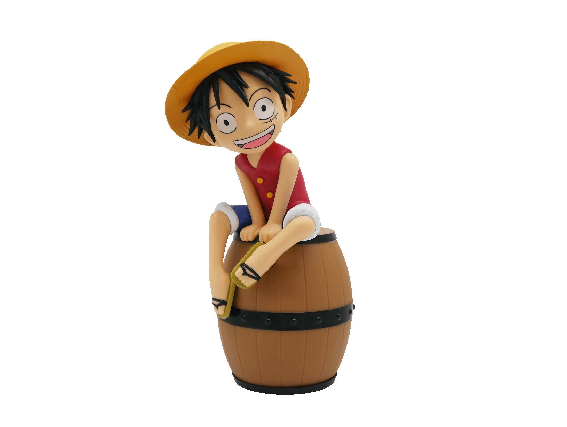 Eine Figur von Monkey D. Luffy sitzt auf einem Holzfass.