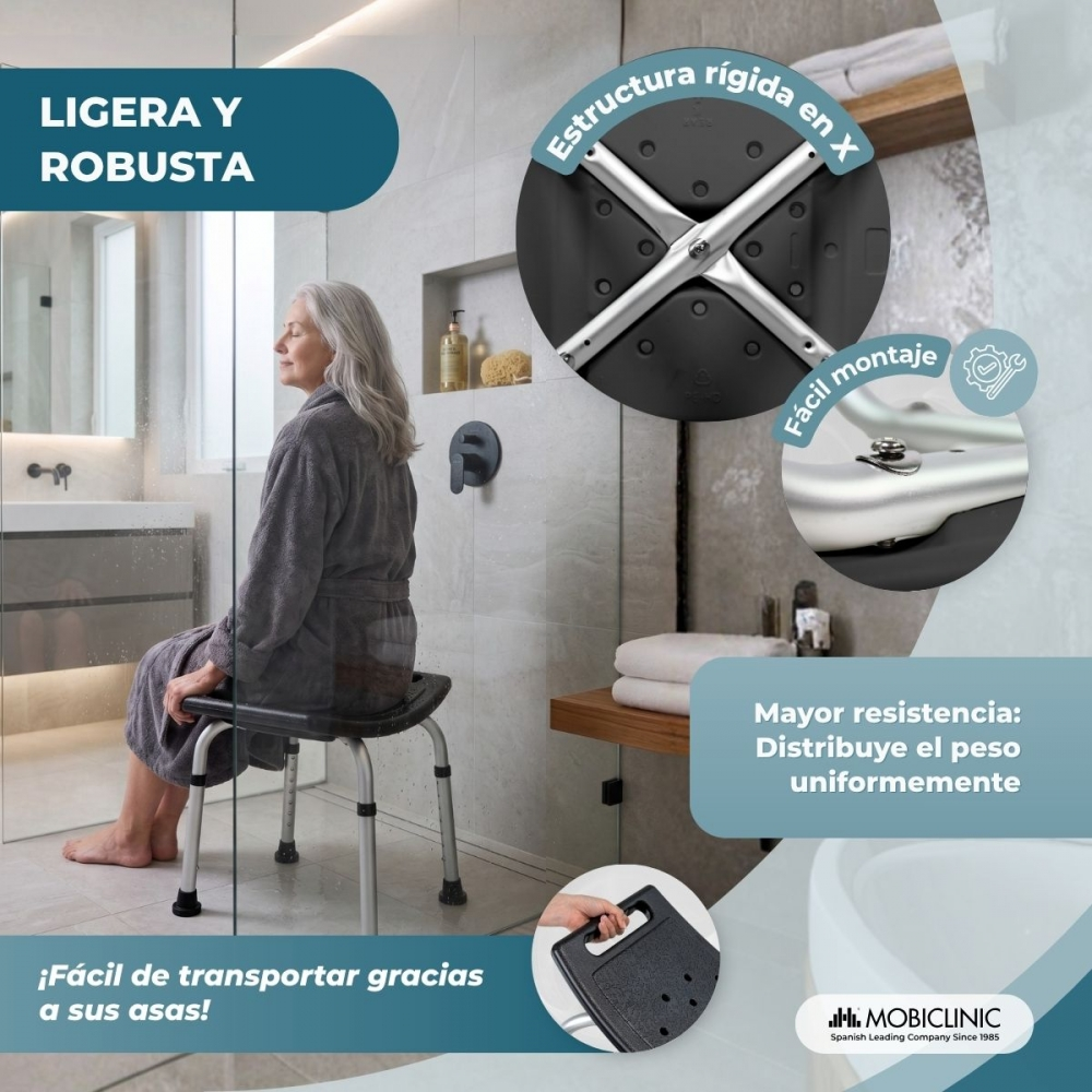 Mujer mayor sentada en taburete de ducha con estructura en X en baño moderno.