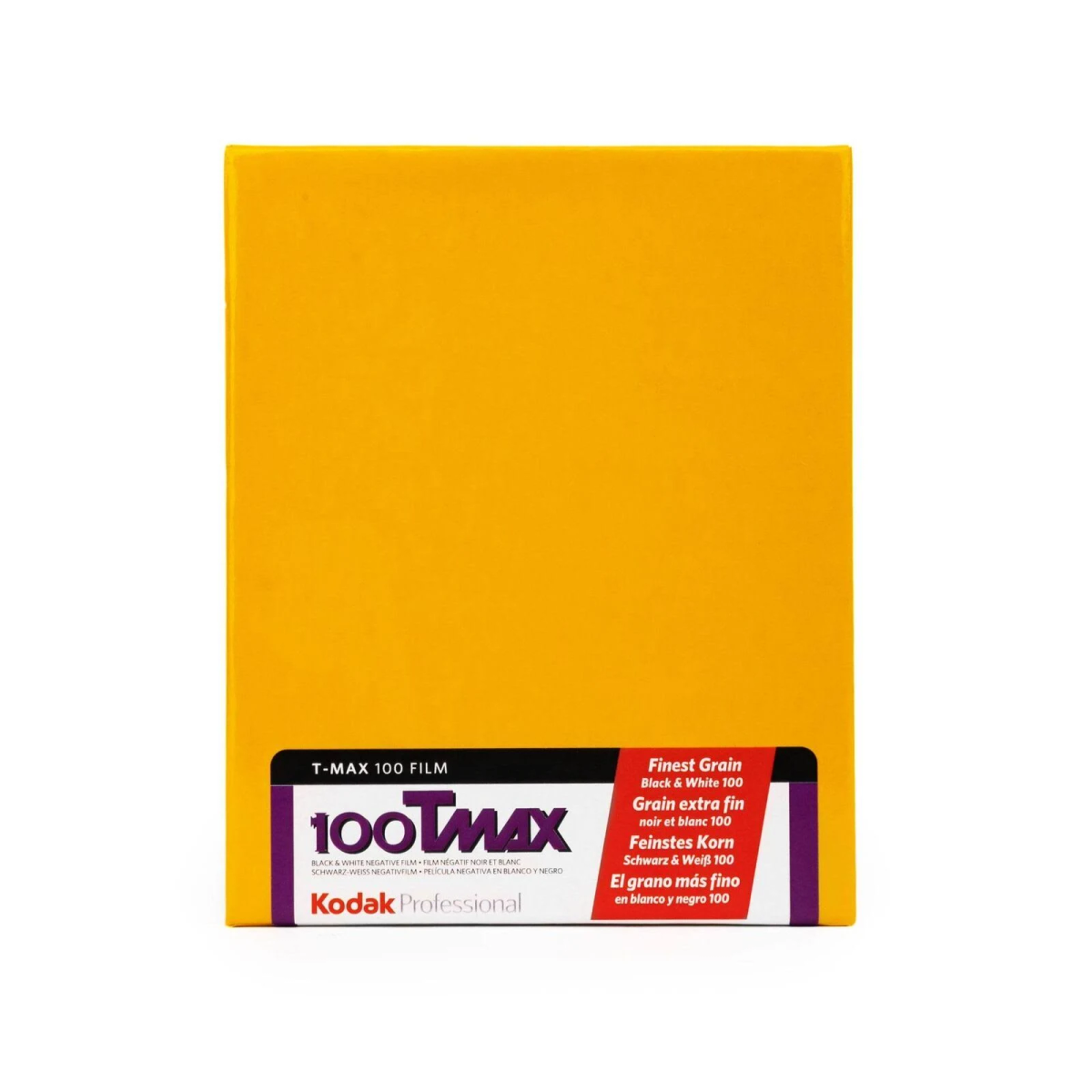 Caja amarilla de película Kodak T-MAX 100 con etiqueta negra e información multilingüe.