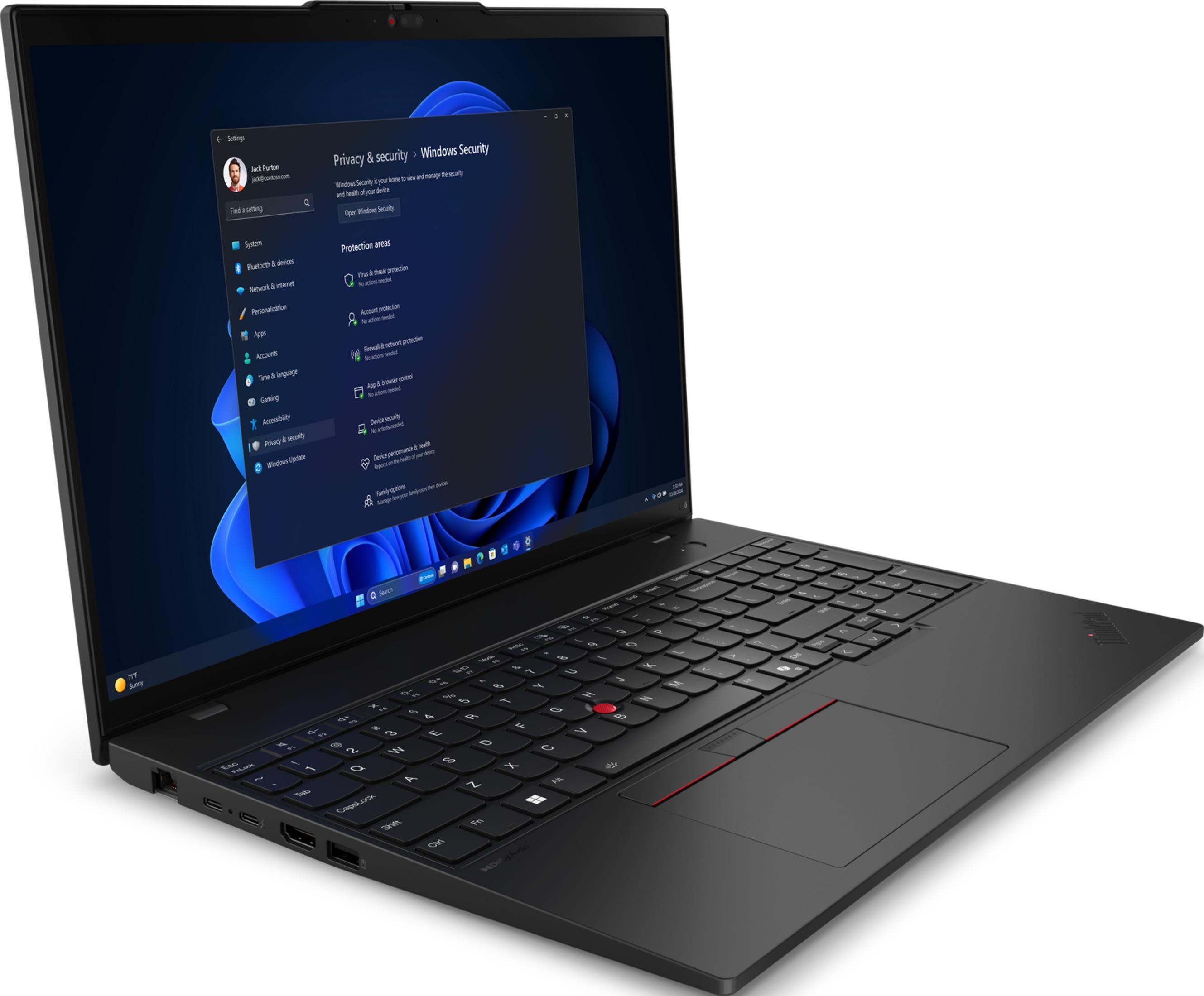 Un laptop nero mostra le impostazioni di Windows 11 con "Privacy e sicurezza" aperto.