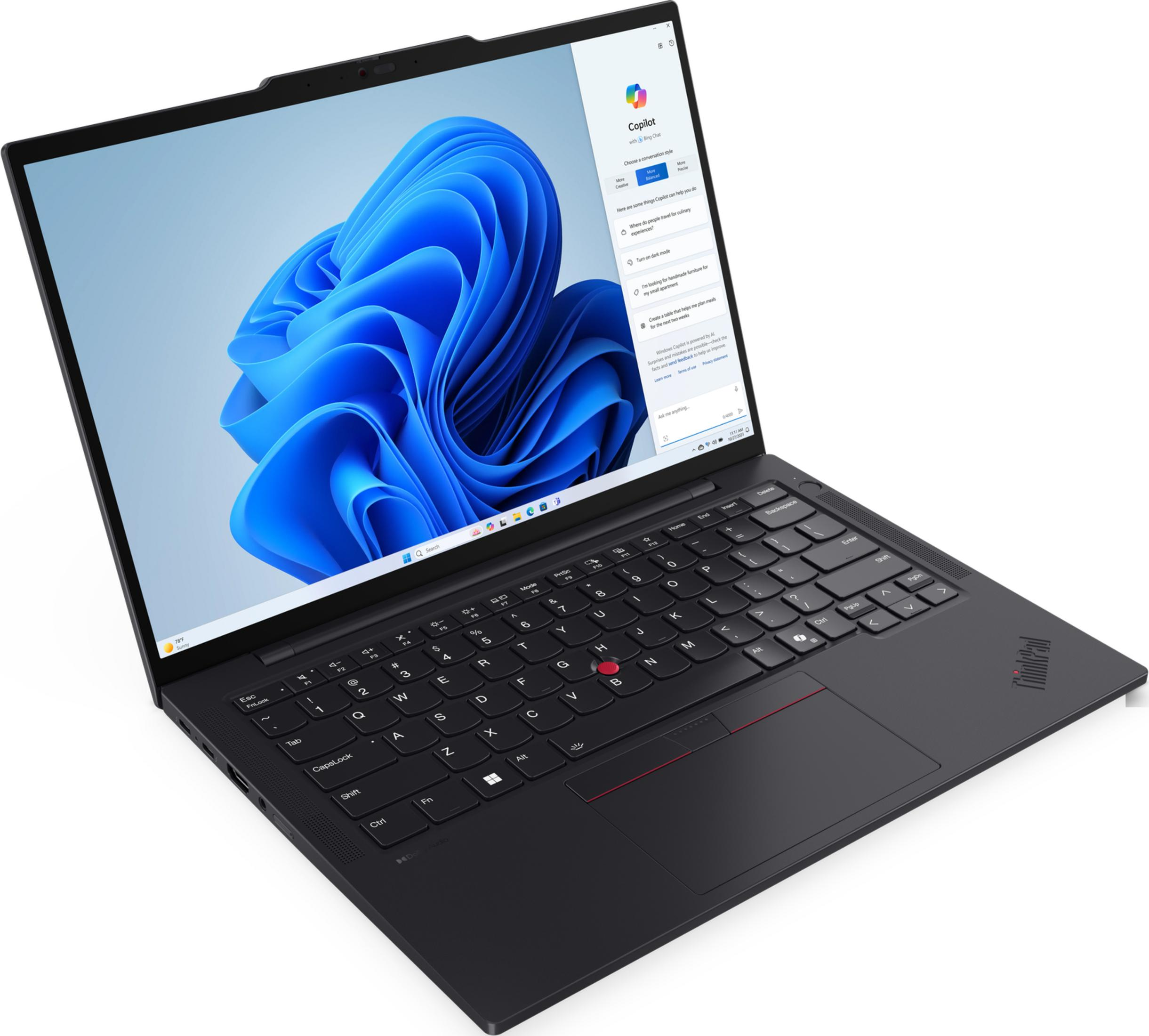 Un laptop nero con sfondo blu e l'app Copilot aperta.
