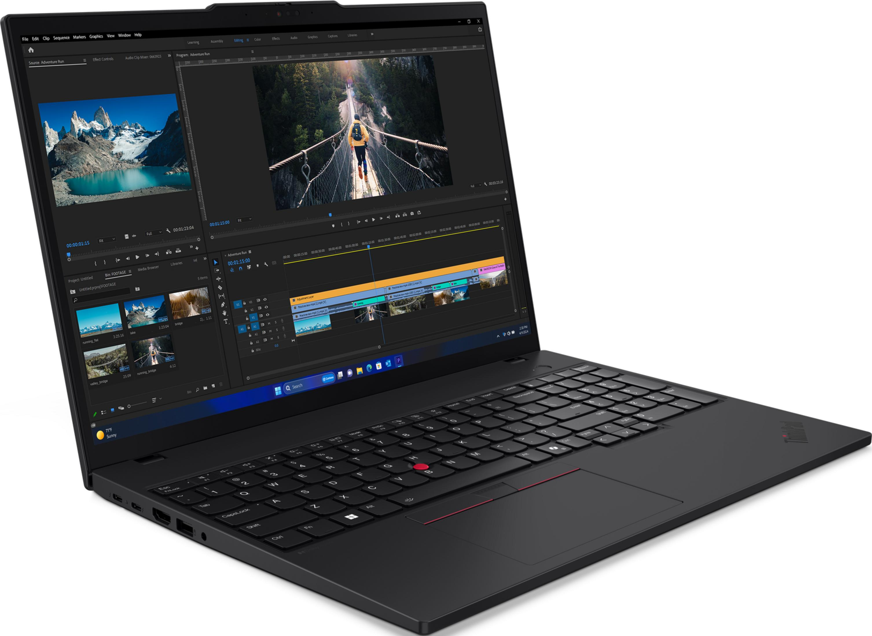 Laptop nero che mostra software di editing video con scene di montagne e ponti sospesi sullo schermo.