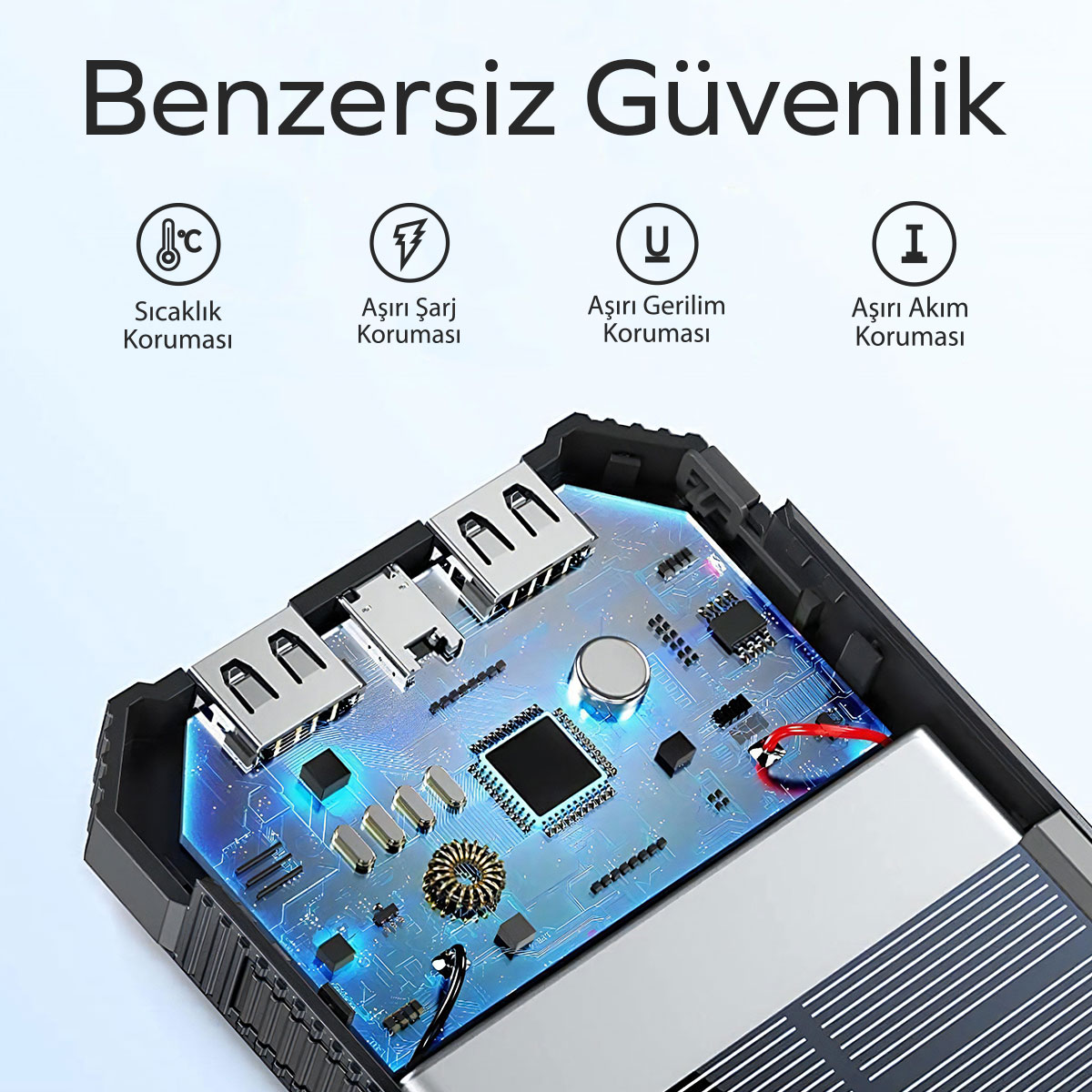 USB bağlantı noktalarını ve devre kartını gösteren siyah ve gümüş bir cihazın içi.