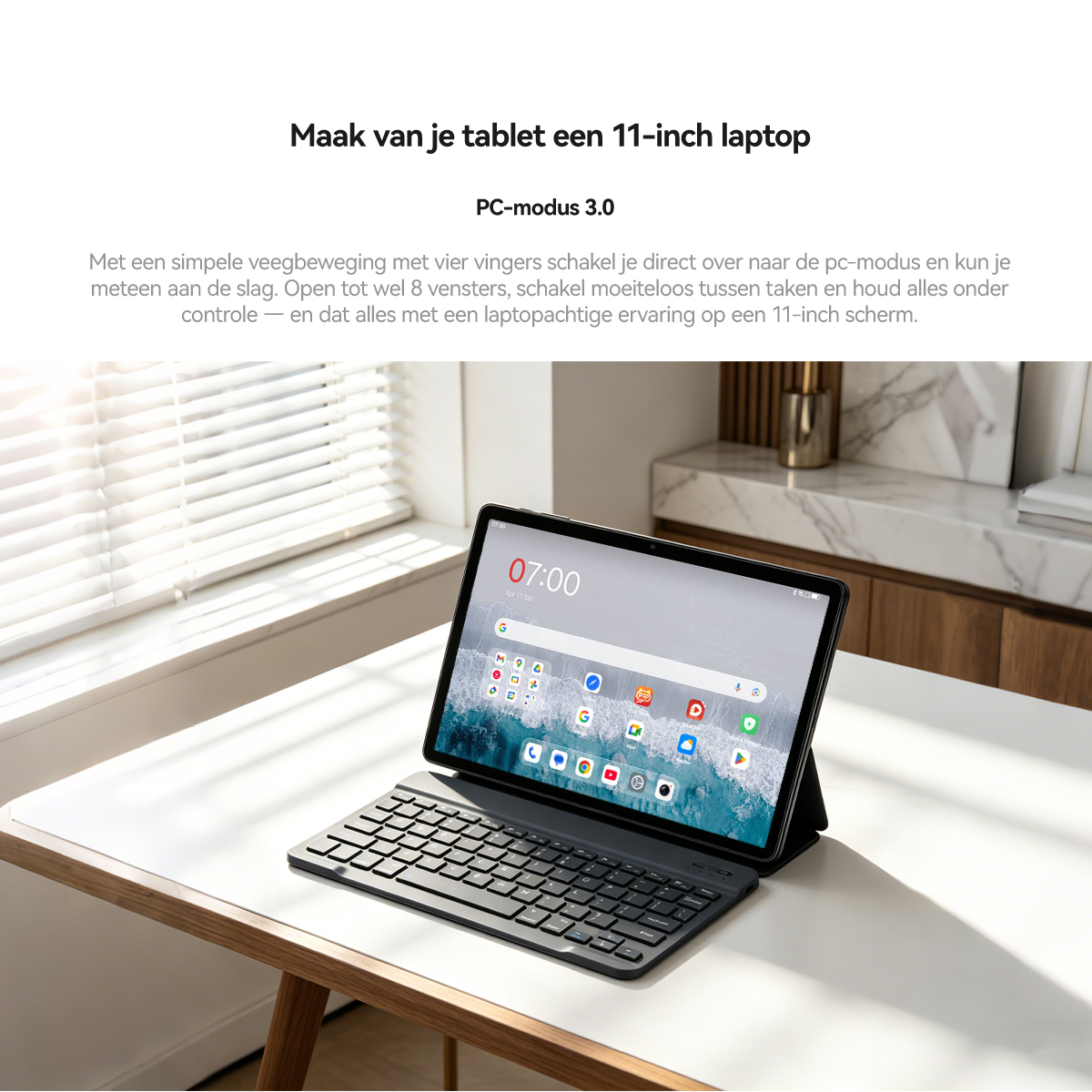 An 11-inch tablet with a keyboard sits on a table. The screen displays 07:00.