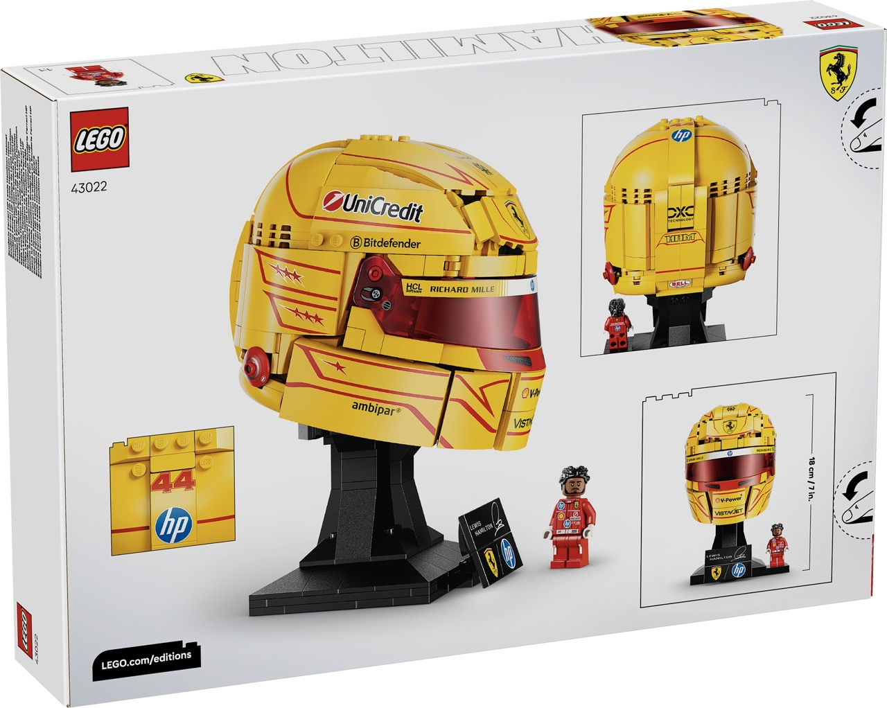 Kırmızı vurgular ve sponsor logoları olan sarı kask replikasını gösteren LEGO kutusu.
