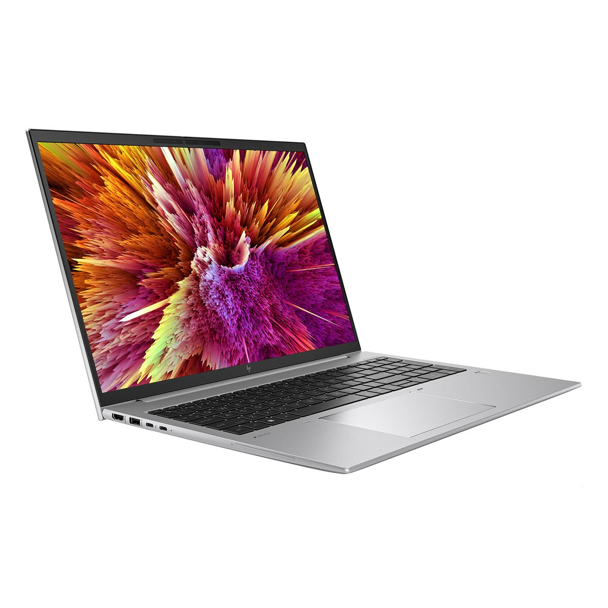Srebrny laptop z kolorową, wybuchową tapetą na ekranie.