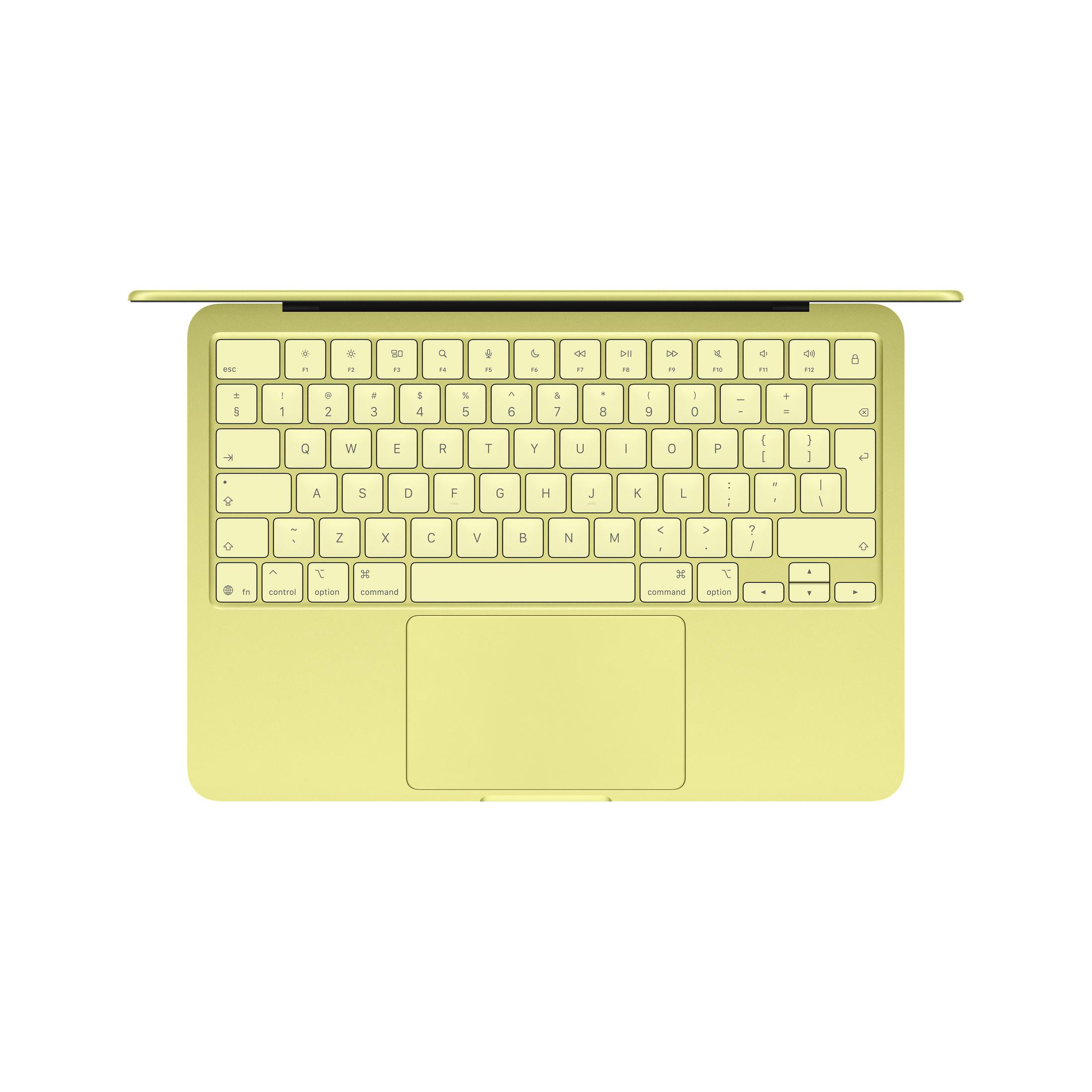 Un clavier et trackpad de MacBook jaune sont montrés de dessus sur fond blanc.