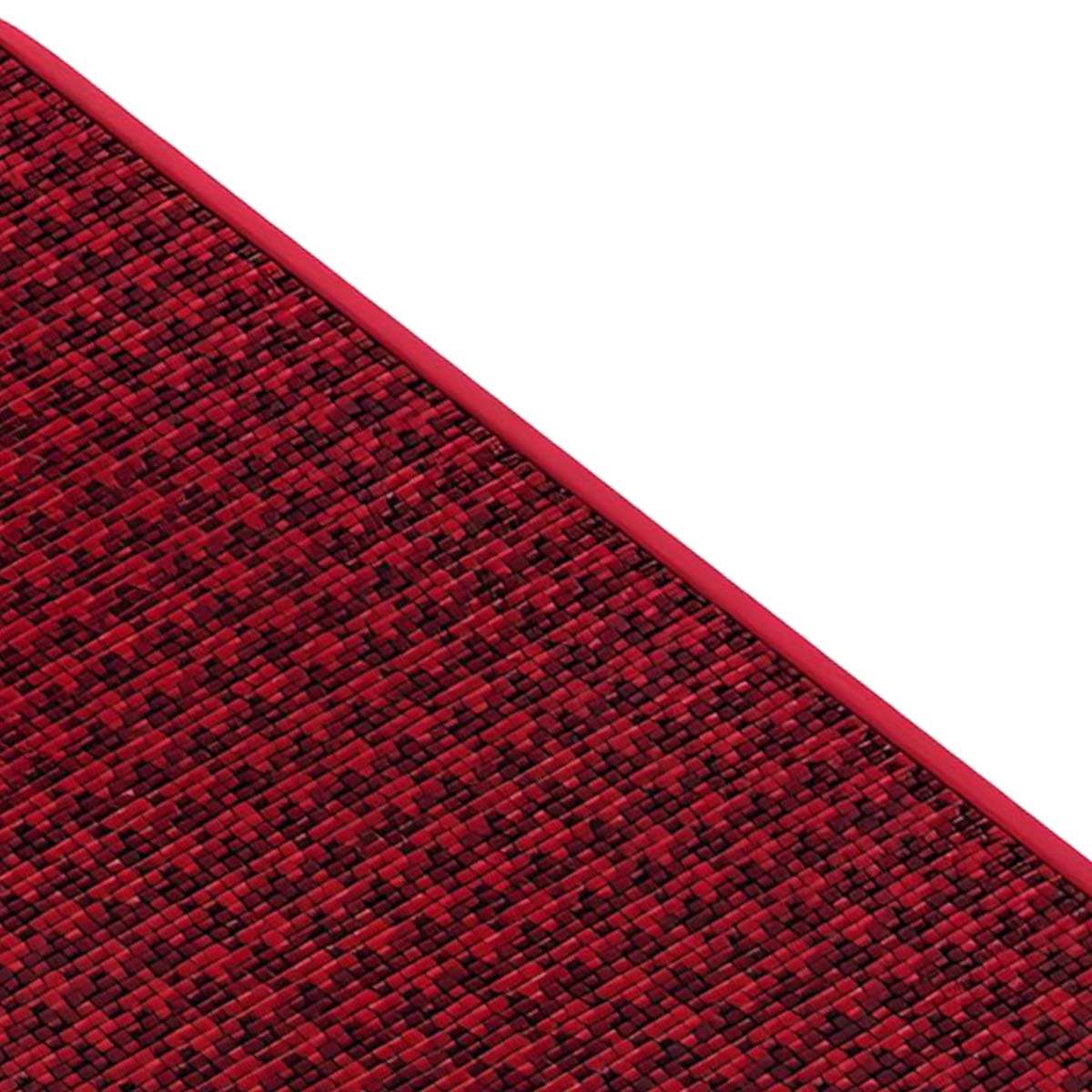 Trama tessuta rossa e nera con bordo rosso, in diagonale.