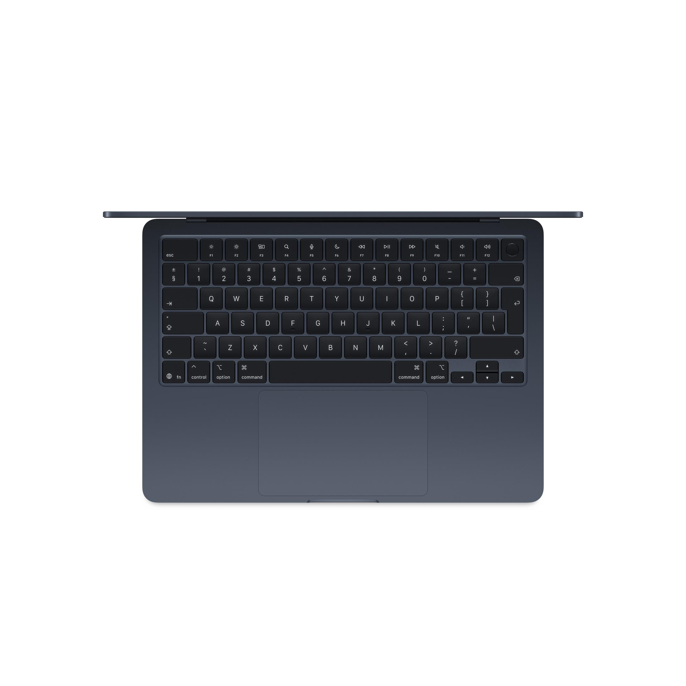 MacBook blu scuro con tastiera e trackpad, vista dall'alto.