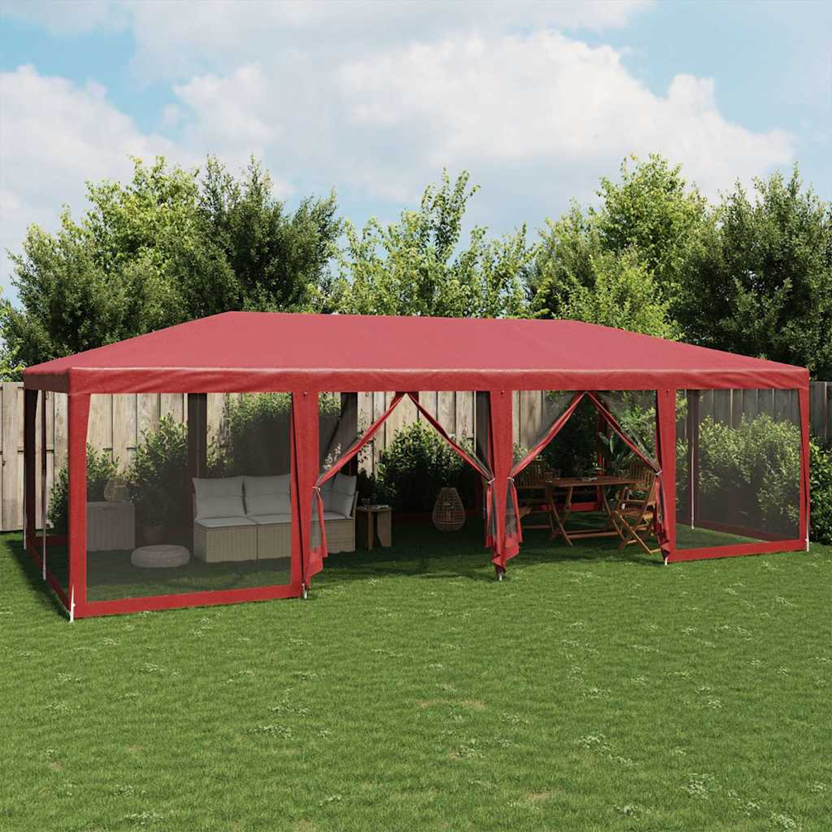 Tenda gazebo rossa con posti a sedere e tavolo in giardino.