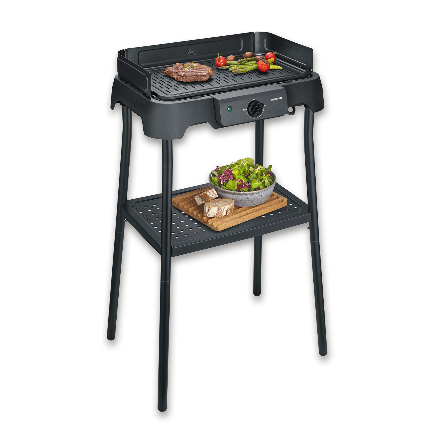 Una parrilla eléctrica con bistec, verduras y ensalada. Hay pan debajo.