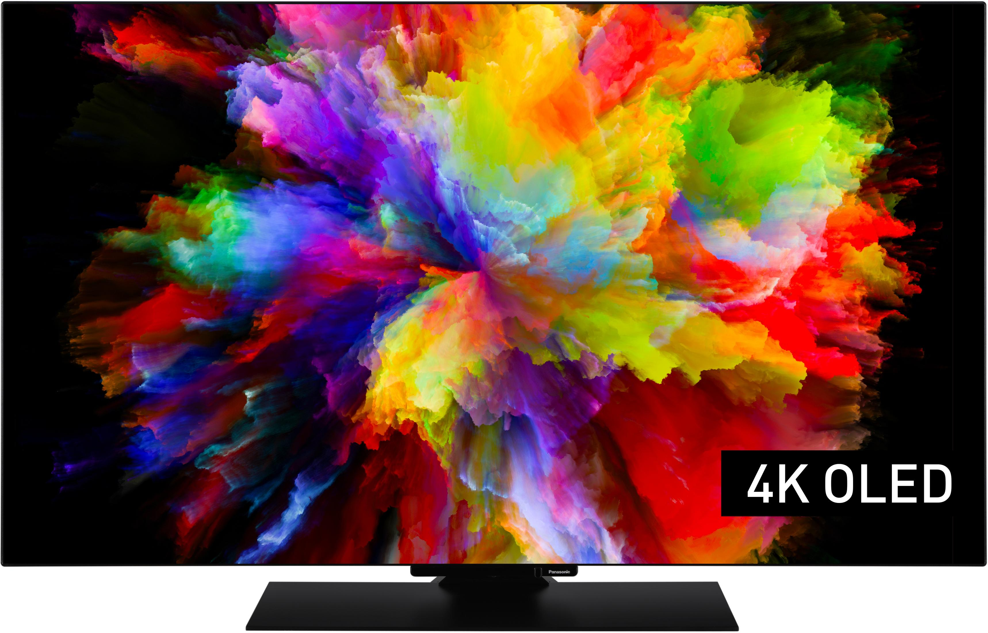 Un televisor negro con una imagen abstracta y colorida y texto "4K OLED".