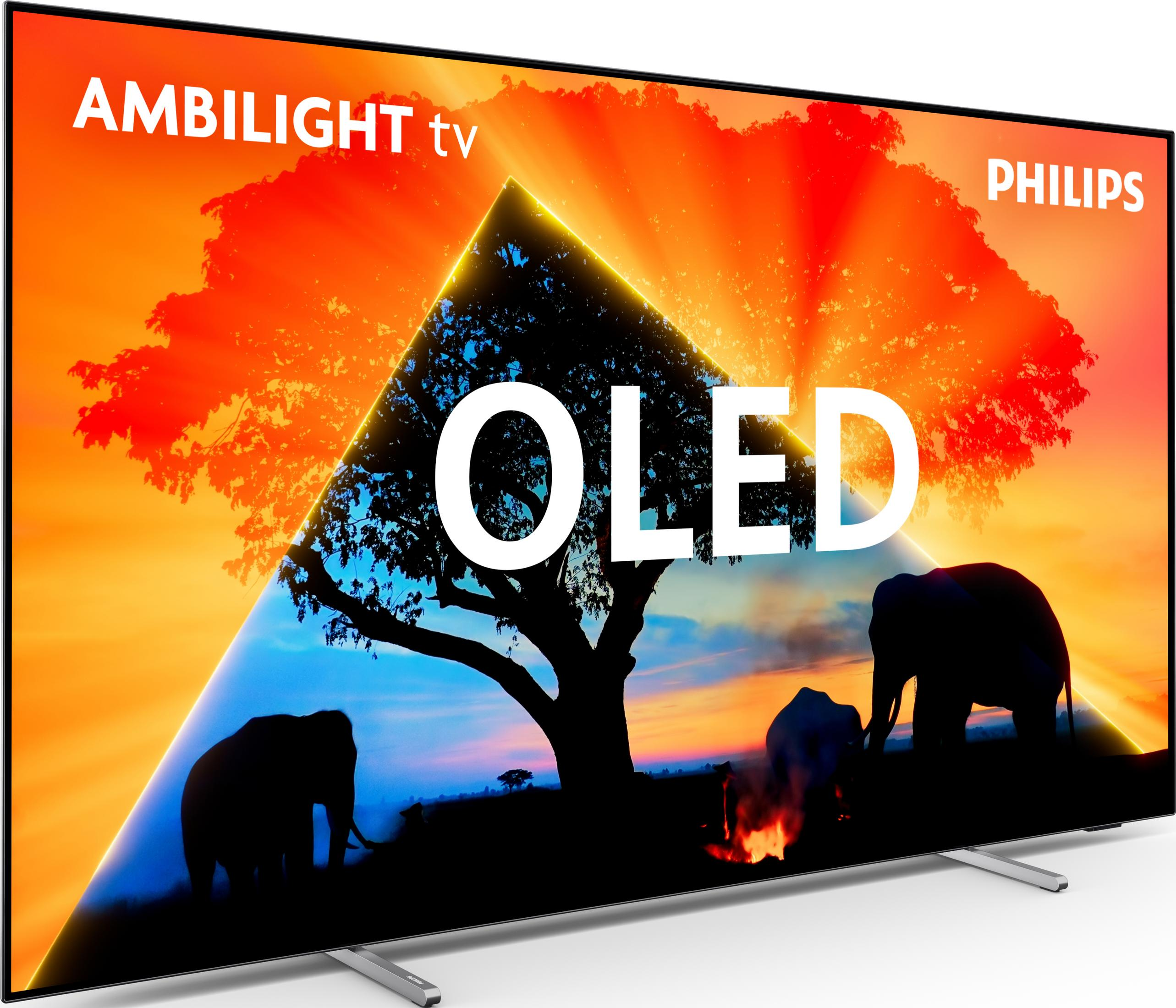 Ein Philips OLED TV zeigt eine Savannenlandschaft mit Elefanten und einem Lagerfeuer.