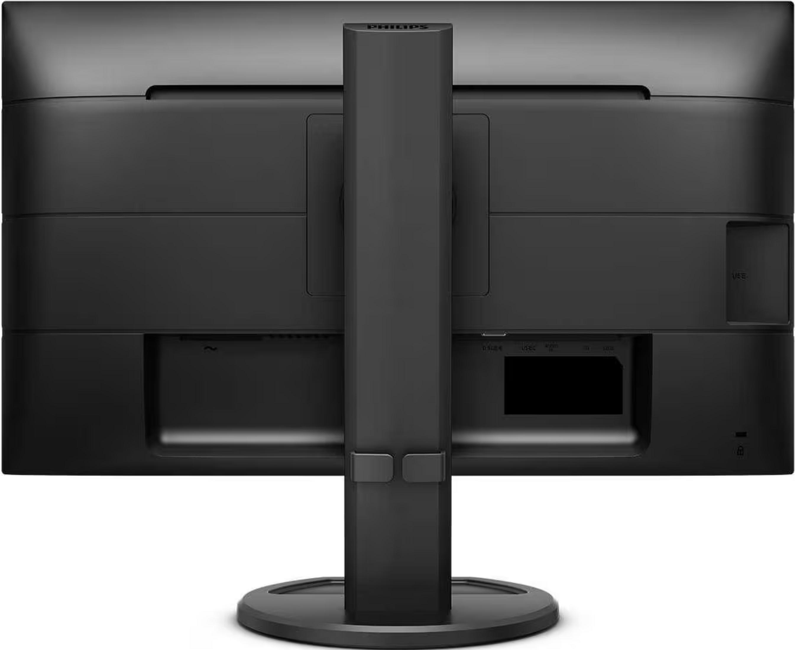 Achterkant van een zwarte monitor met poorten en een centrale standaard.