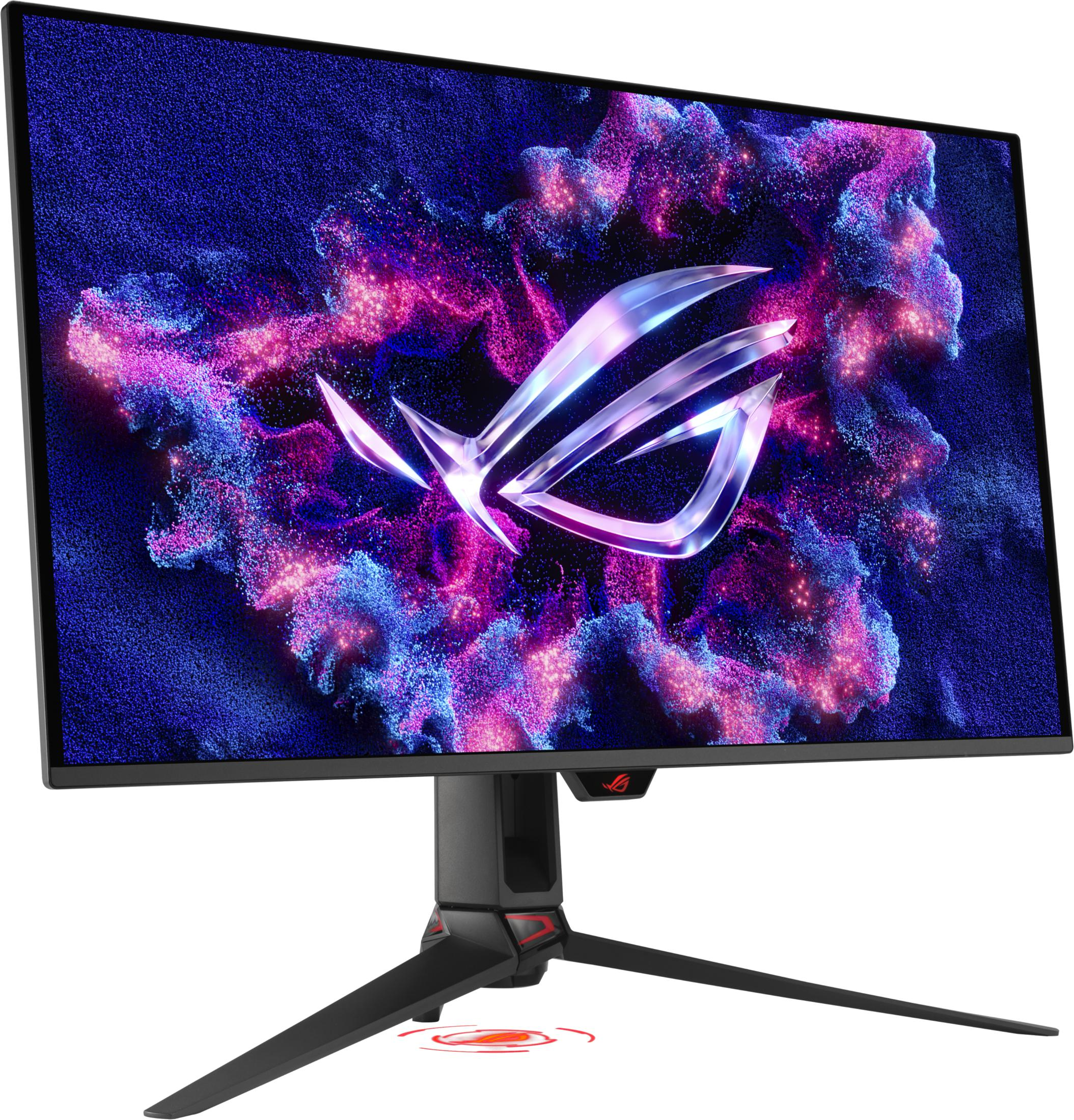 Monitor gamingowy z srebrnym logo ROG na abstrakcyjnym tle niebieskich i fioletowych cząstek.