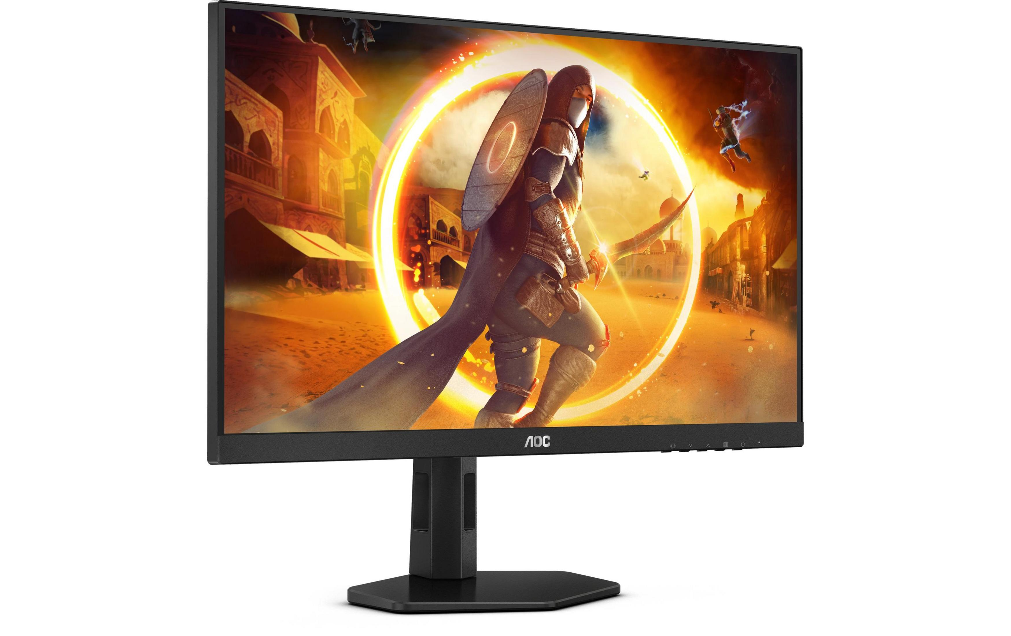 Un monitor muestra un juego de combate de fantasía, con un guerrero frente a un palacio oriental.