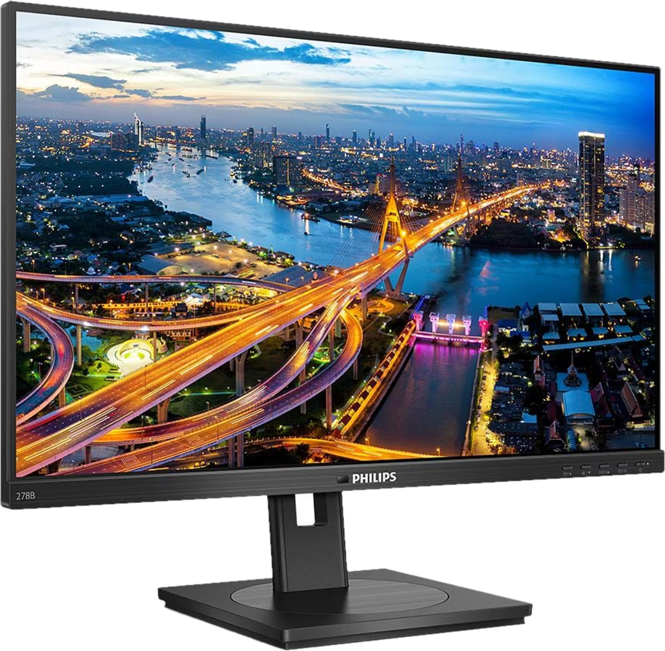 Monitor Philips wyświetla tętniący życiem krajobraz miejski o zmierzchu z rzeką i oświetlonymi mostami.