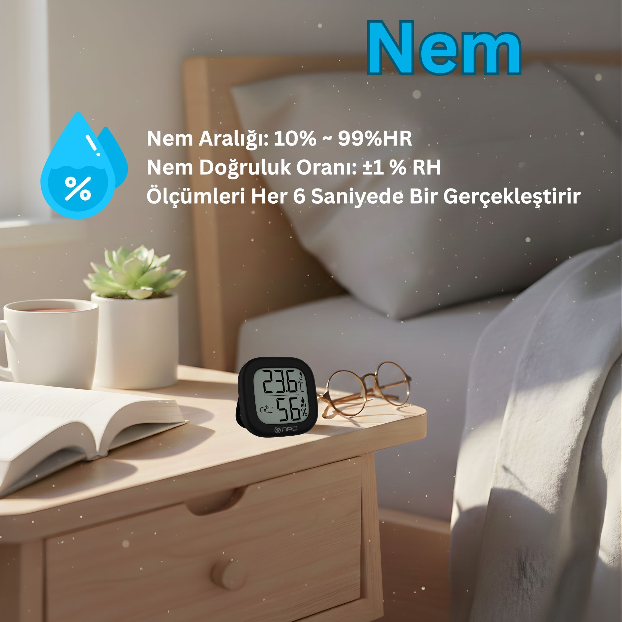 Bir higrometre 23.6°C ve %56 gösteriyor. Yanında gözlük ve açık kitap var.