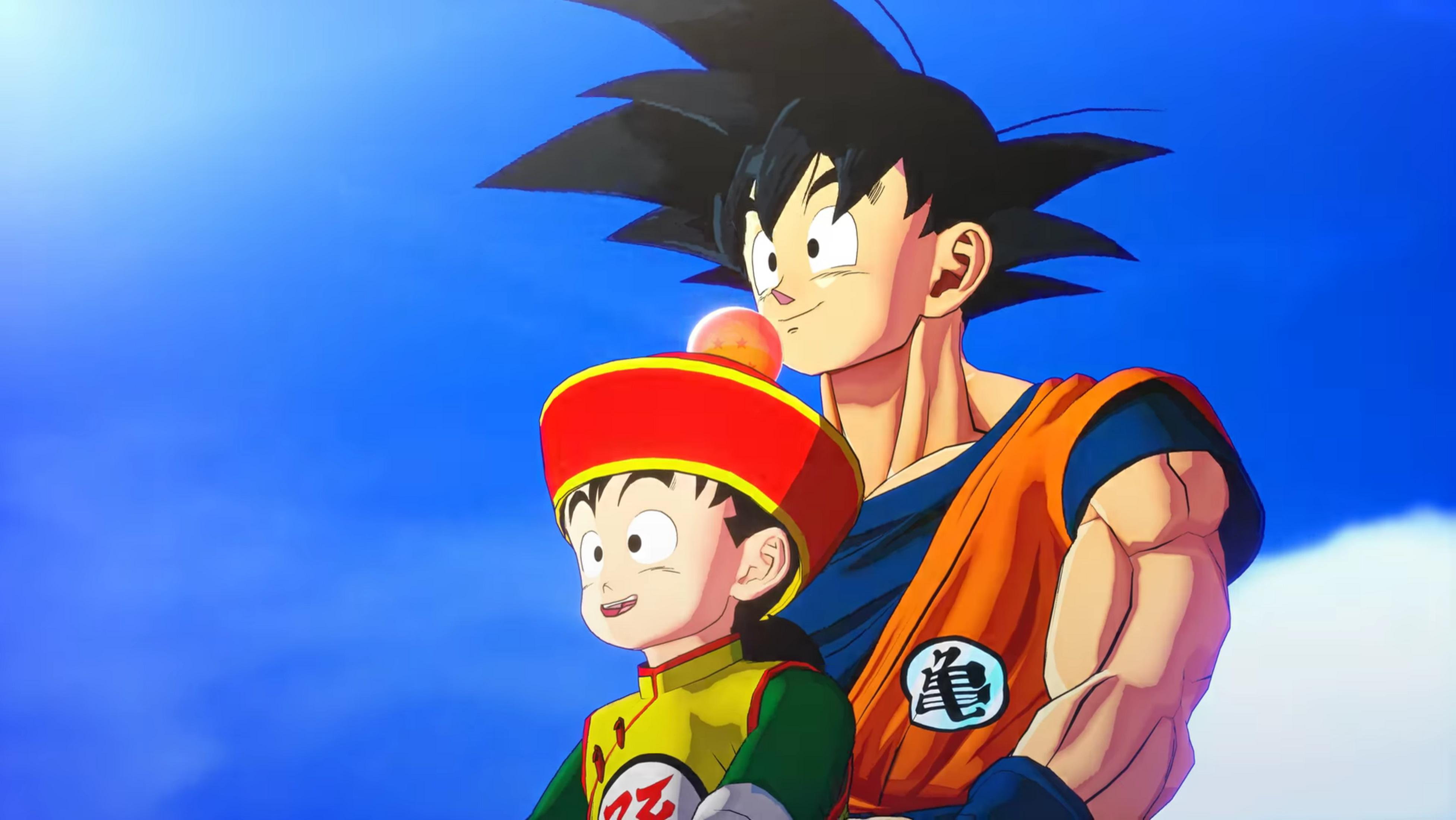 Goku e Gohan sono fianco a fianco sotto un cielo blu. Una palla è visibile.