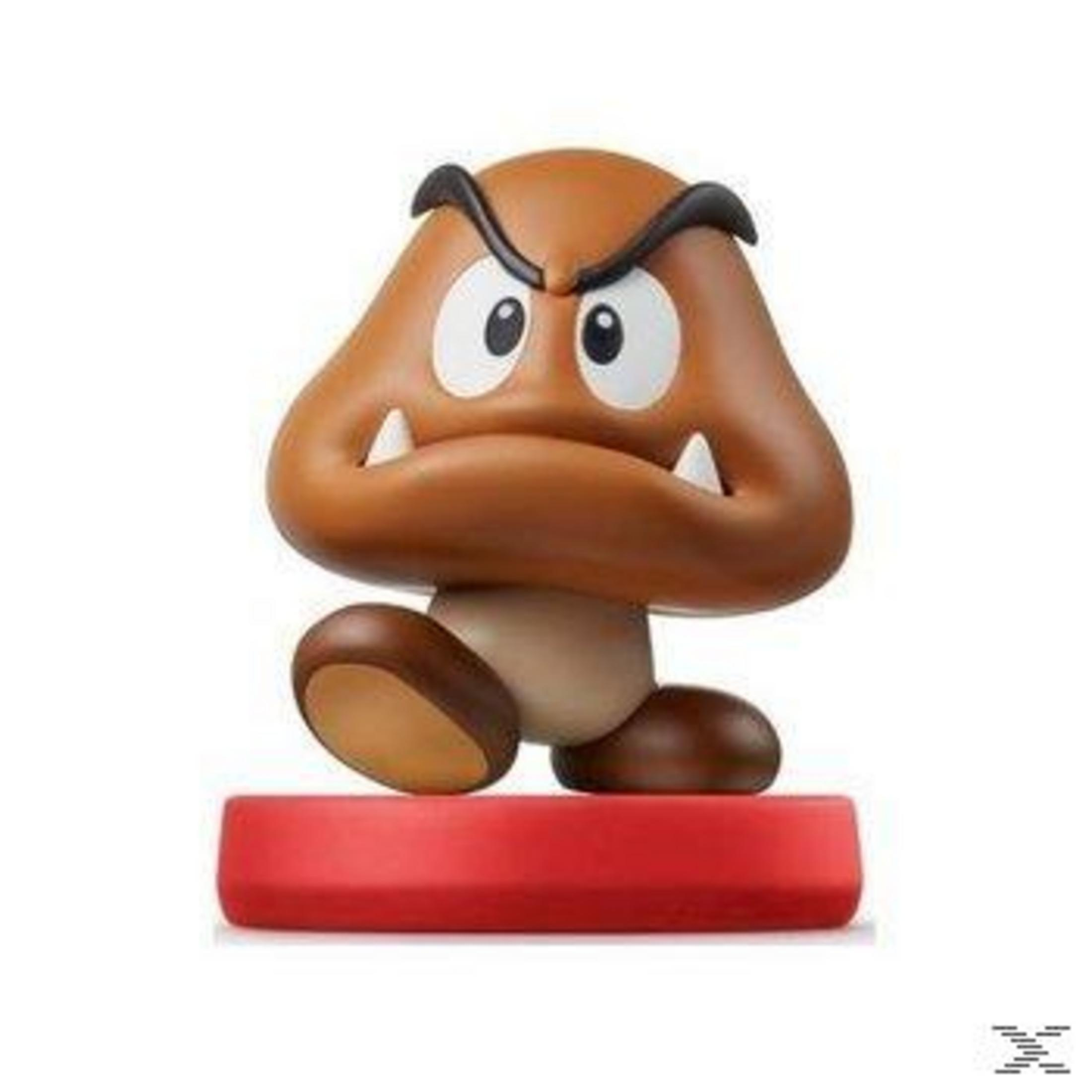 Eine braune Goomba-Figur mit großen Augen steht auf einer roten Basis.