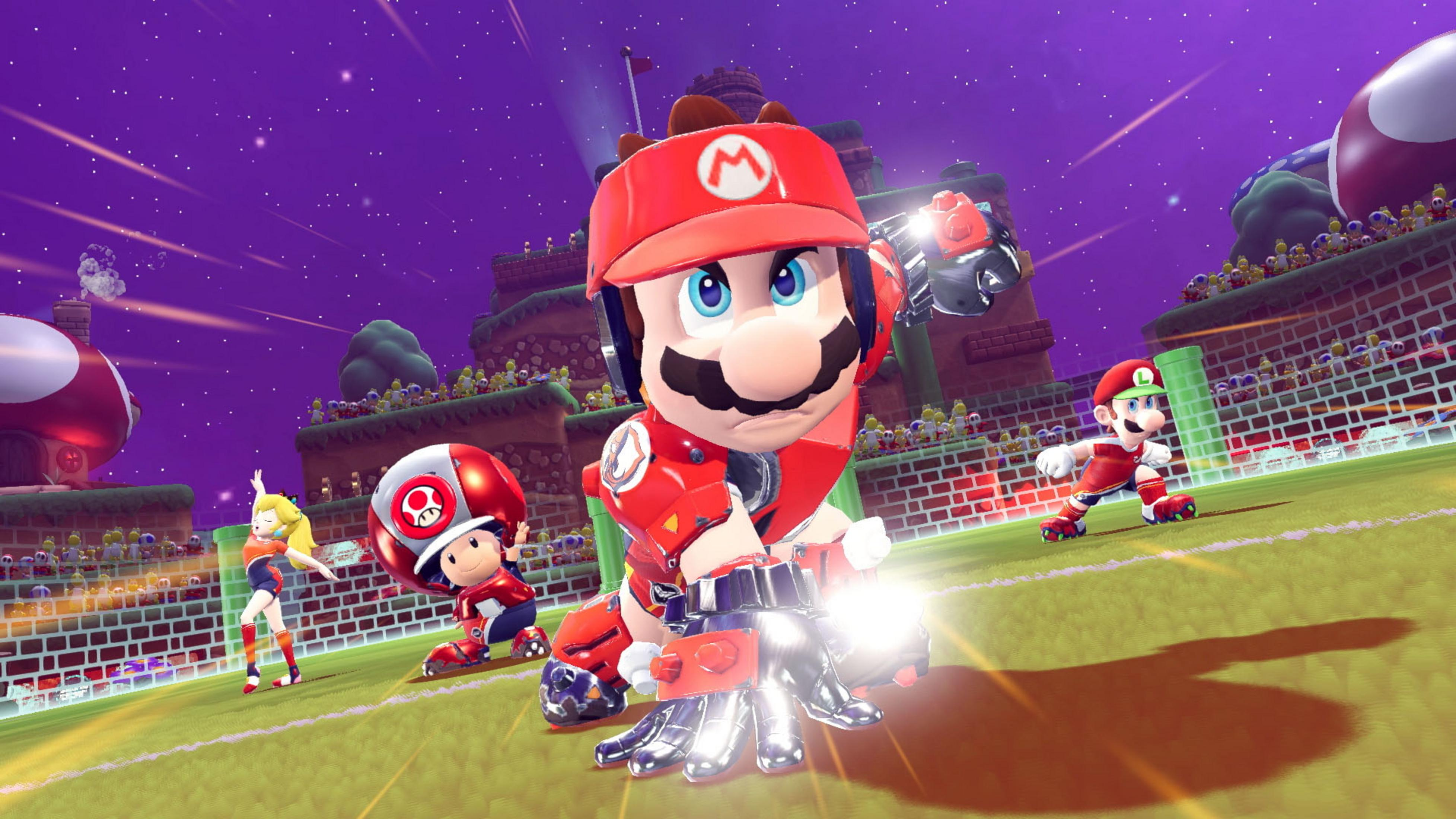 Personaggi di Mario giocano a calcio su un campo con ostacoli a forma di fungo.