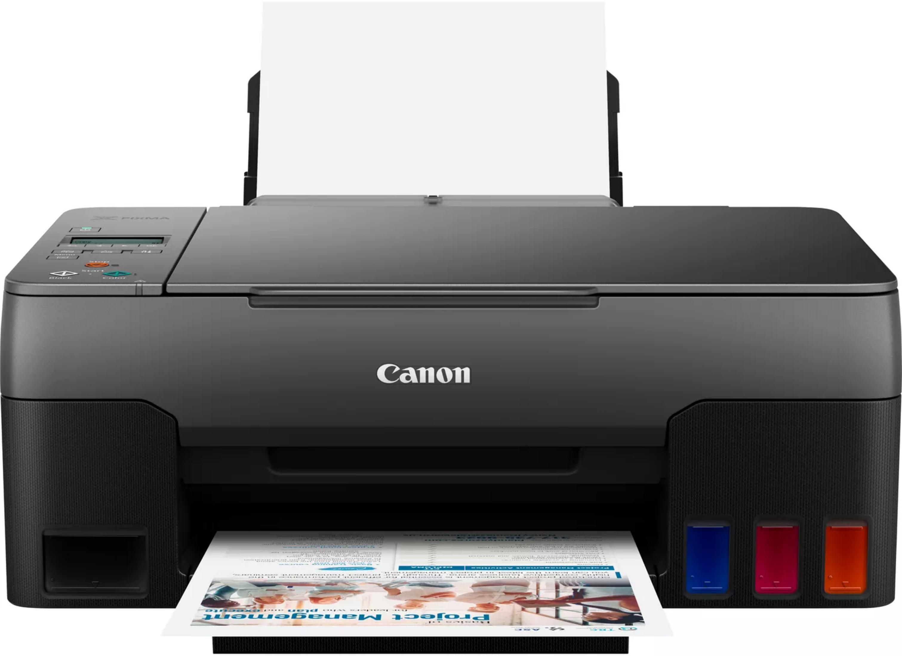Una stampante Canon Pixma nera con un foglio di carta stampato.