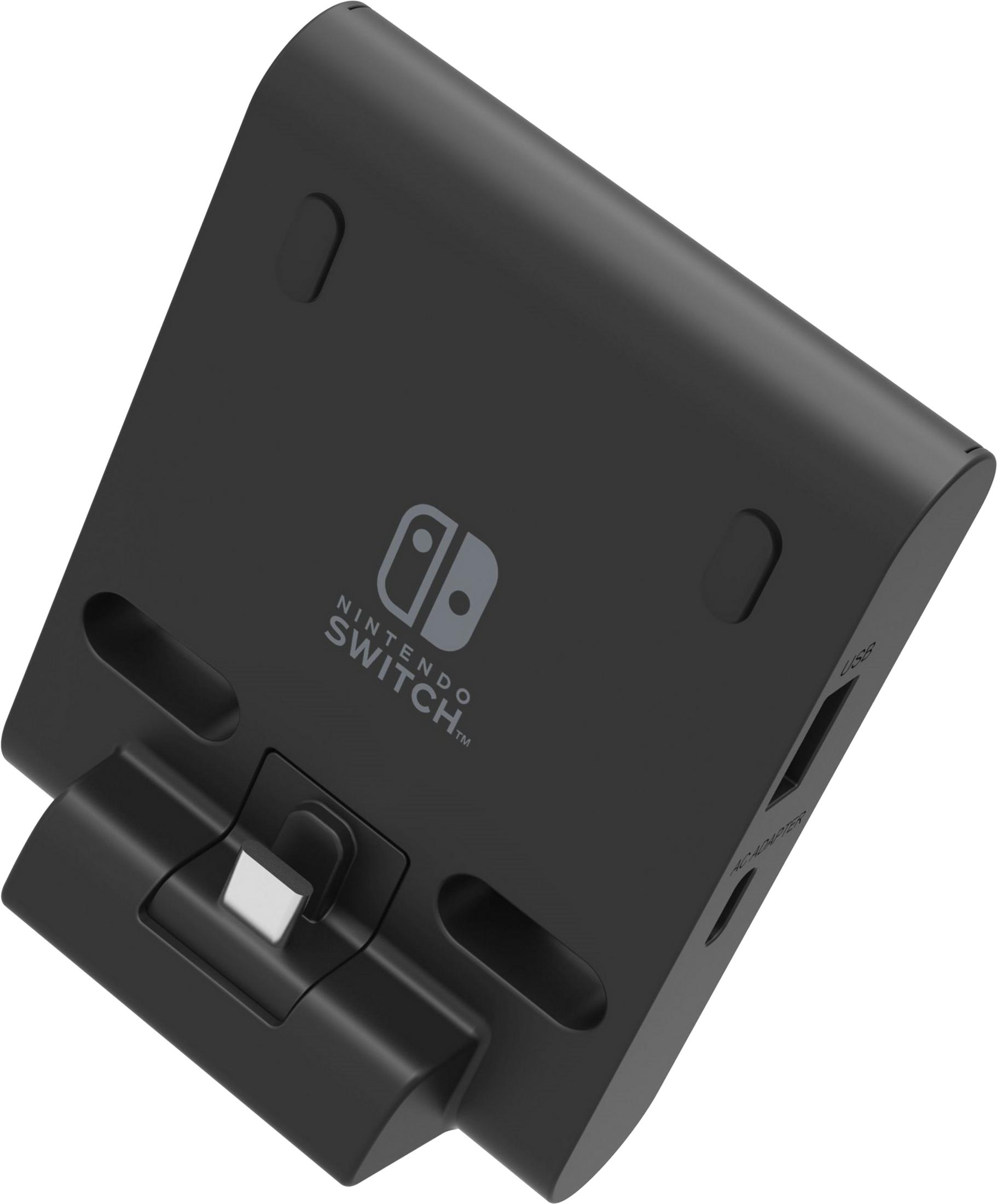 Base negra para Nintendo Switch con puertos USB y adaptador AC.