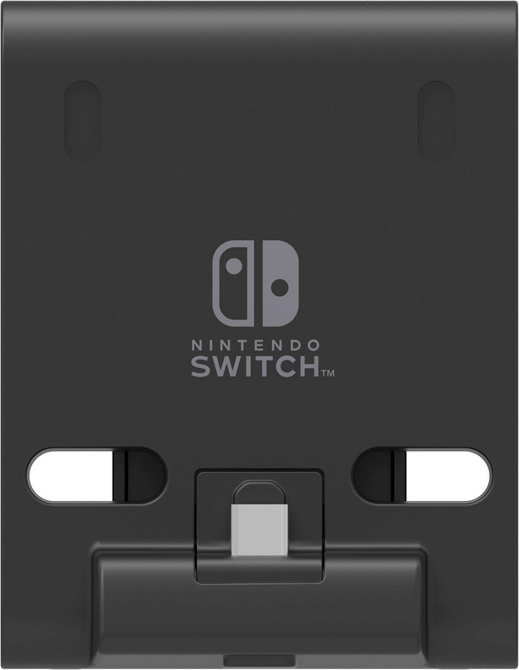 Parte trasera de una base de Nintendo Switch negra con logo.