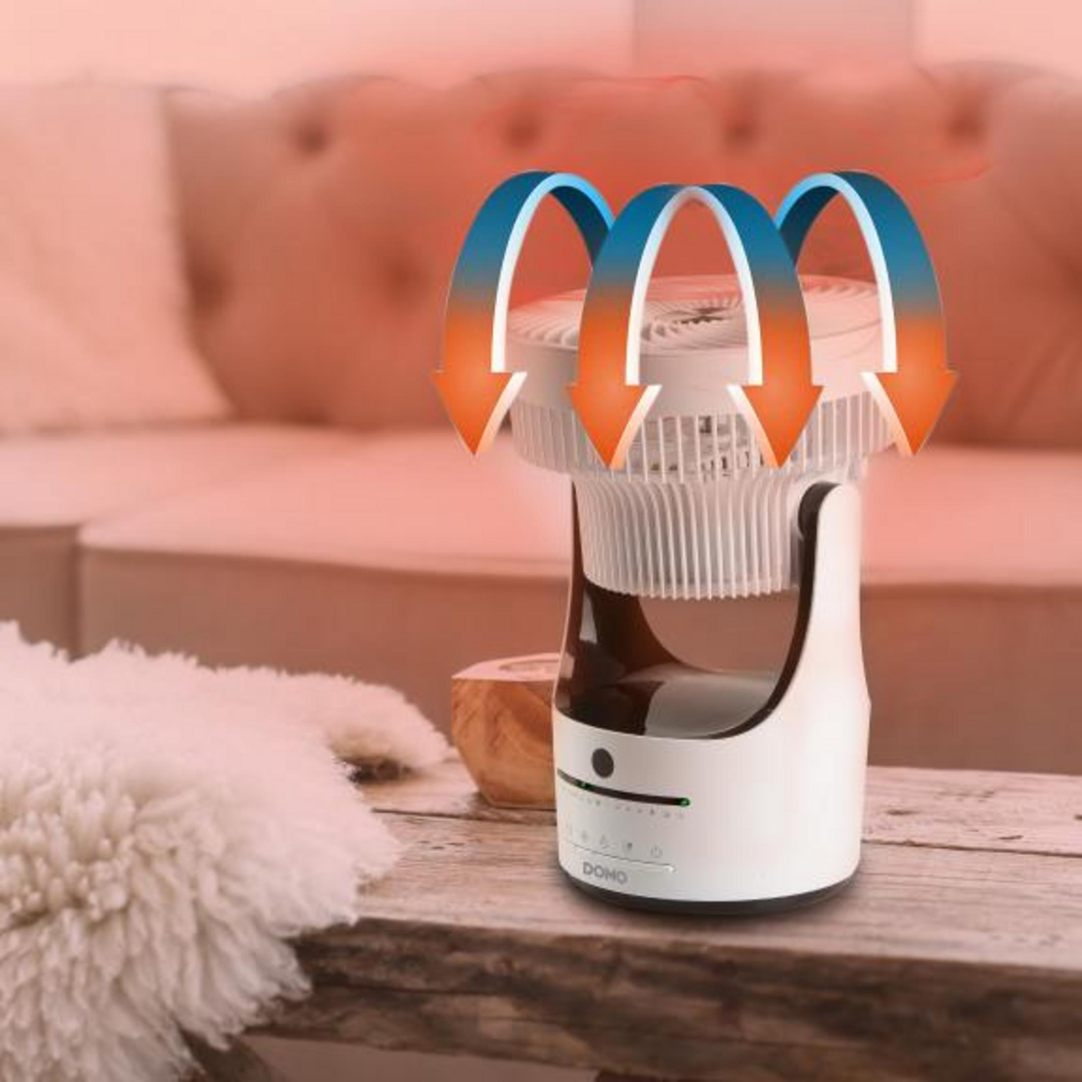 Ein weißer elektrischer Mückenvernichter mit blauen und orangen Pfeilen auf einem Holztisch.