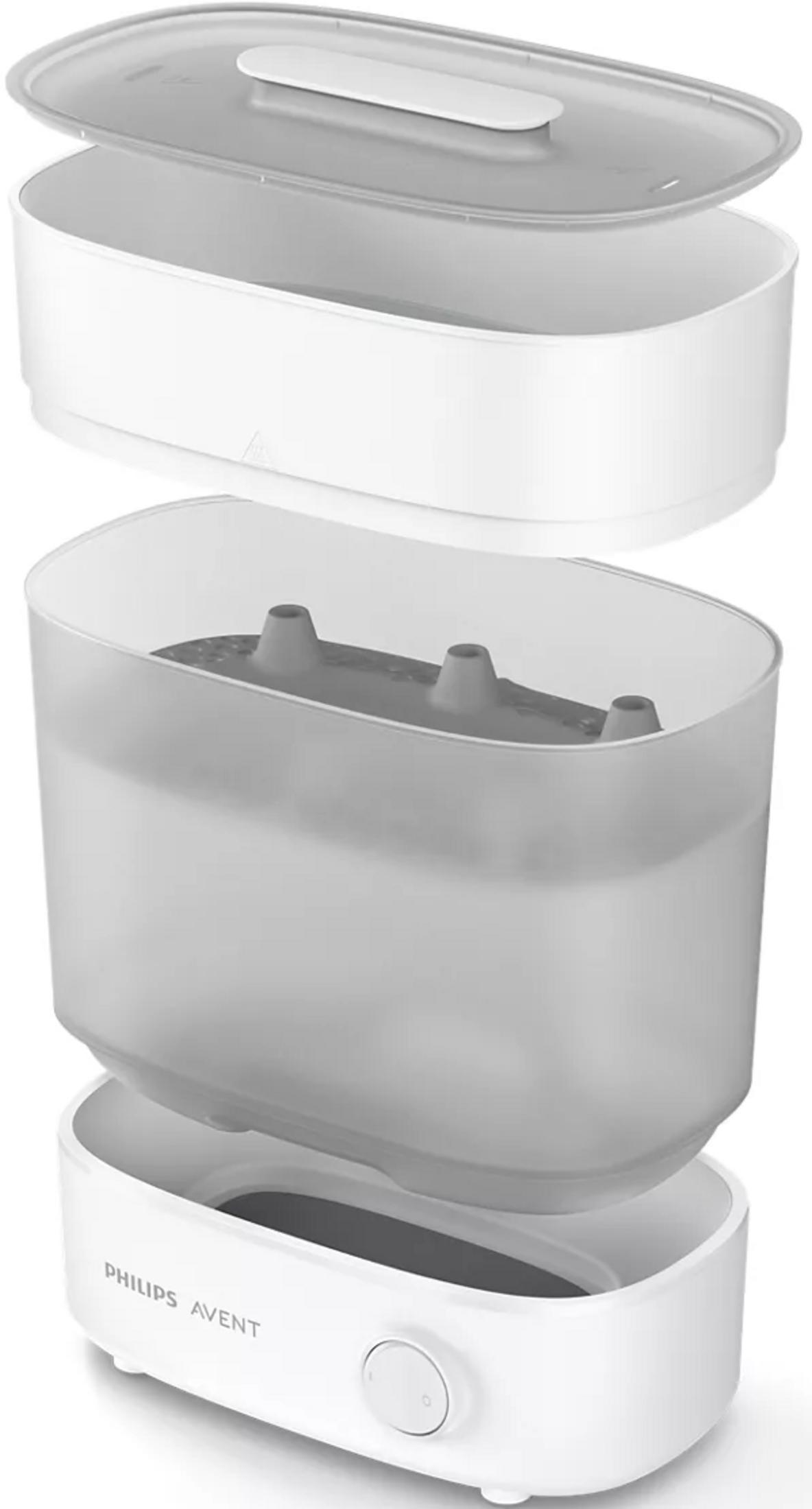 Esterilizador a vapor blanco con contenedor y tapa translúcidos.