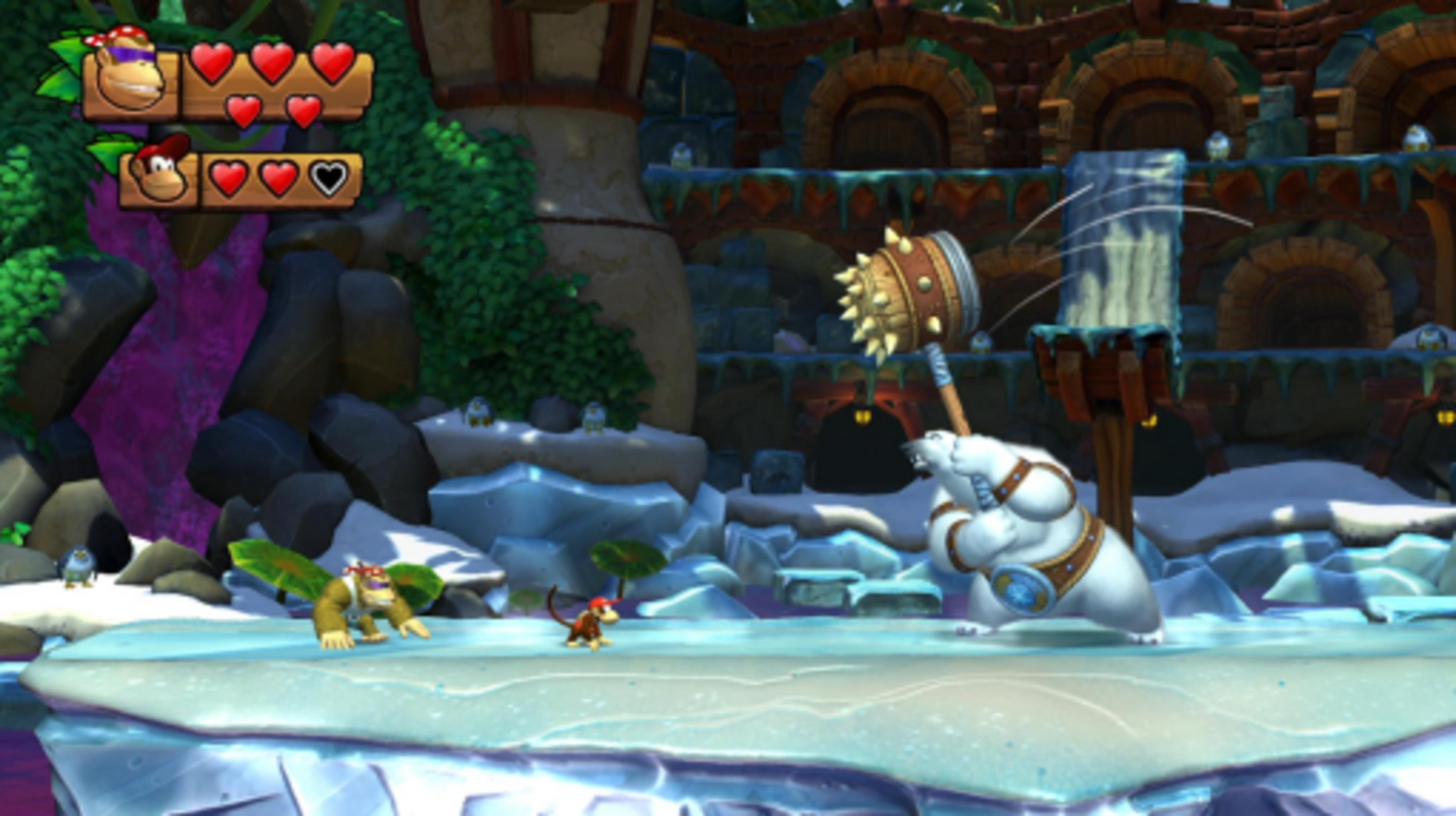 Donkey Kong i Diddy Kong stają naprzeciw niedźwiedzia polarnego z kolczastą maczugą w zaśnieżonym krajobrazie.