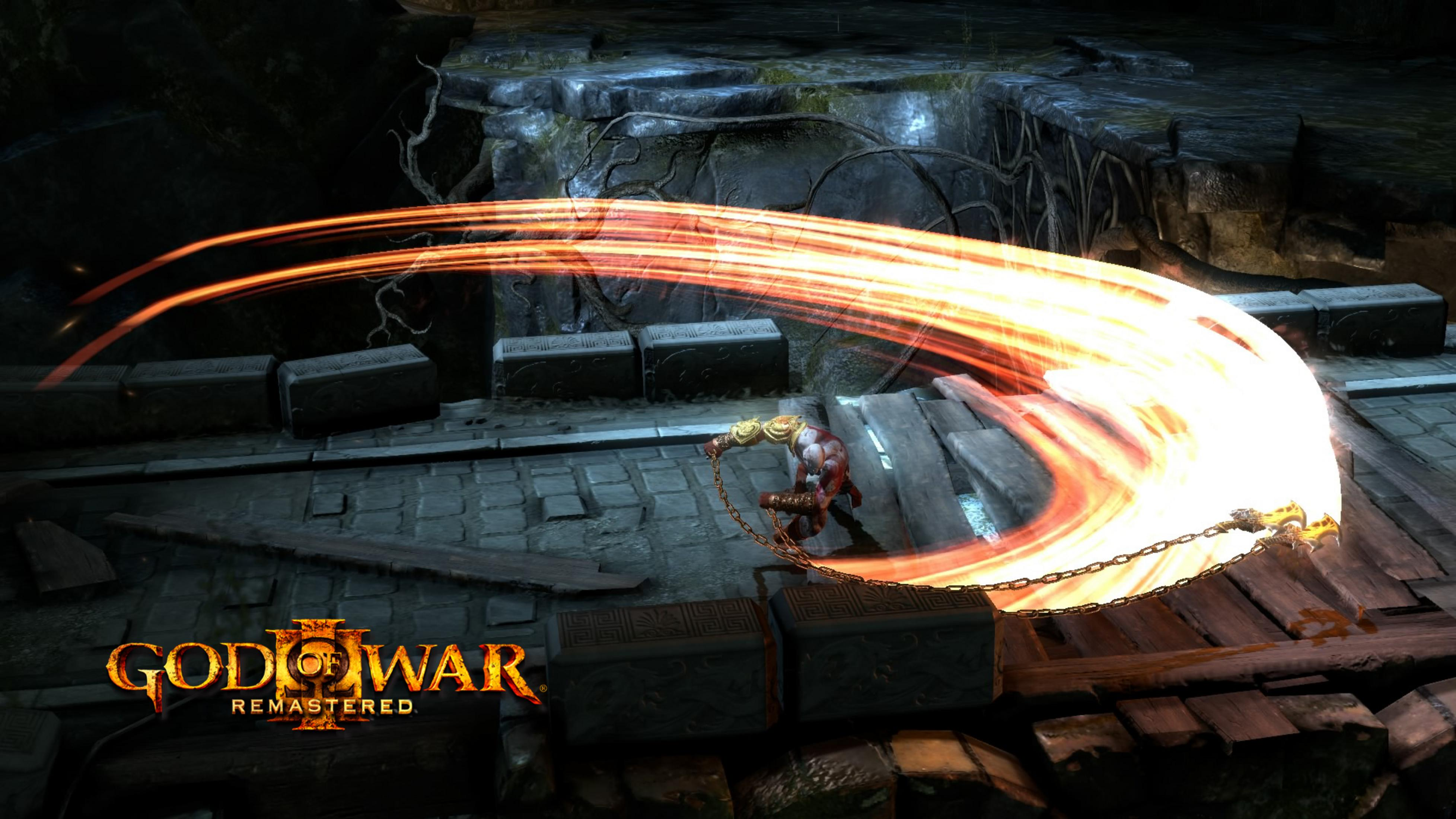 Kratos wymachuje ognistym łańcuchem w ciemnej jaskini. Logo God of War.